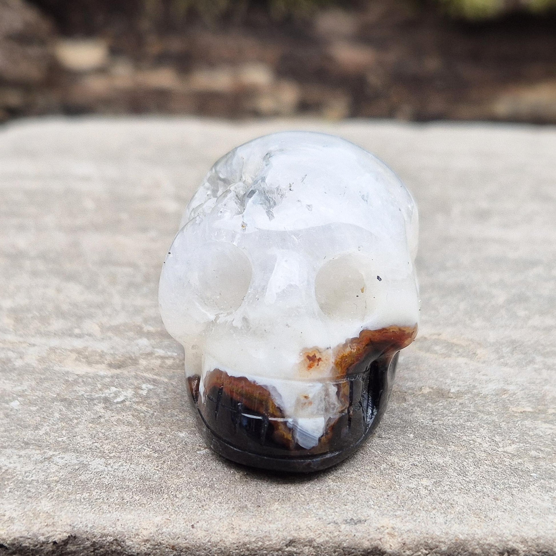 Sardonyx Crystal Skull for strength, protection, and clarity. Supports willpower, honest action, and spiritual stability. Great for home decor or altar work.