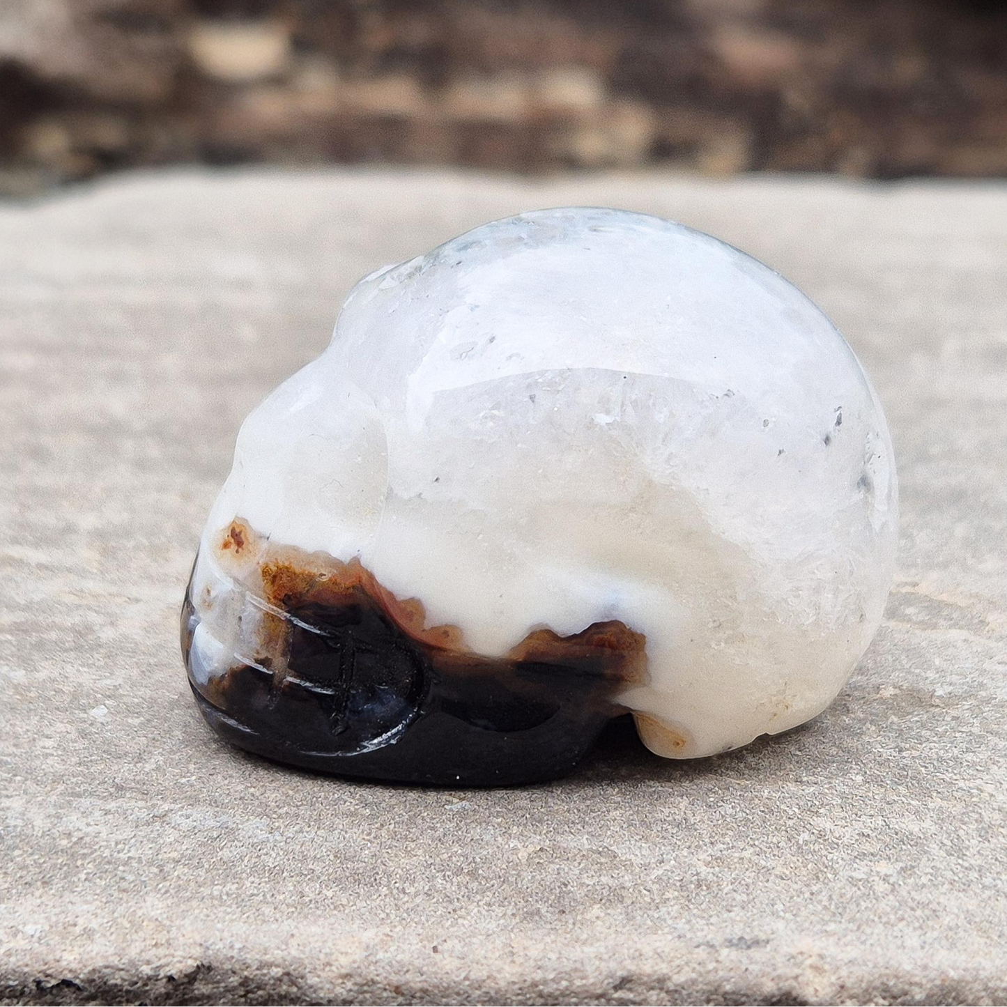 Sardonyx Crystal Skull for strength, protection, and clarity. Supports willpower, honest action, and spiritual stability. Great for home decor or altar work.