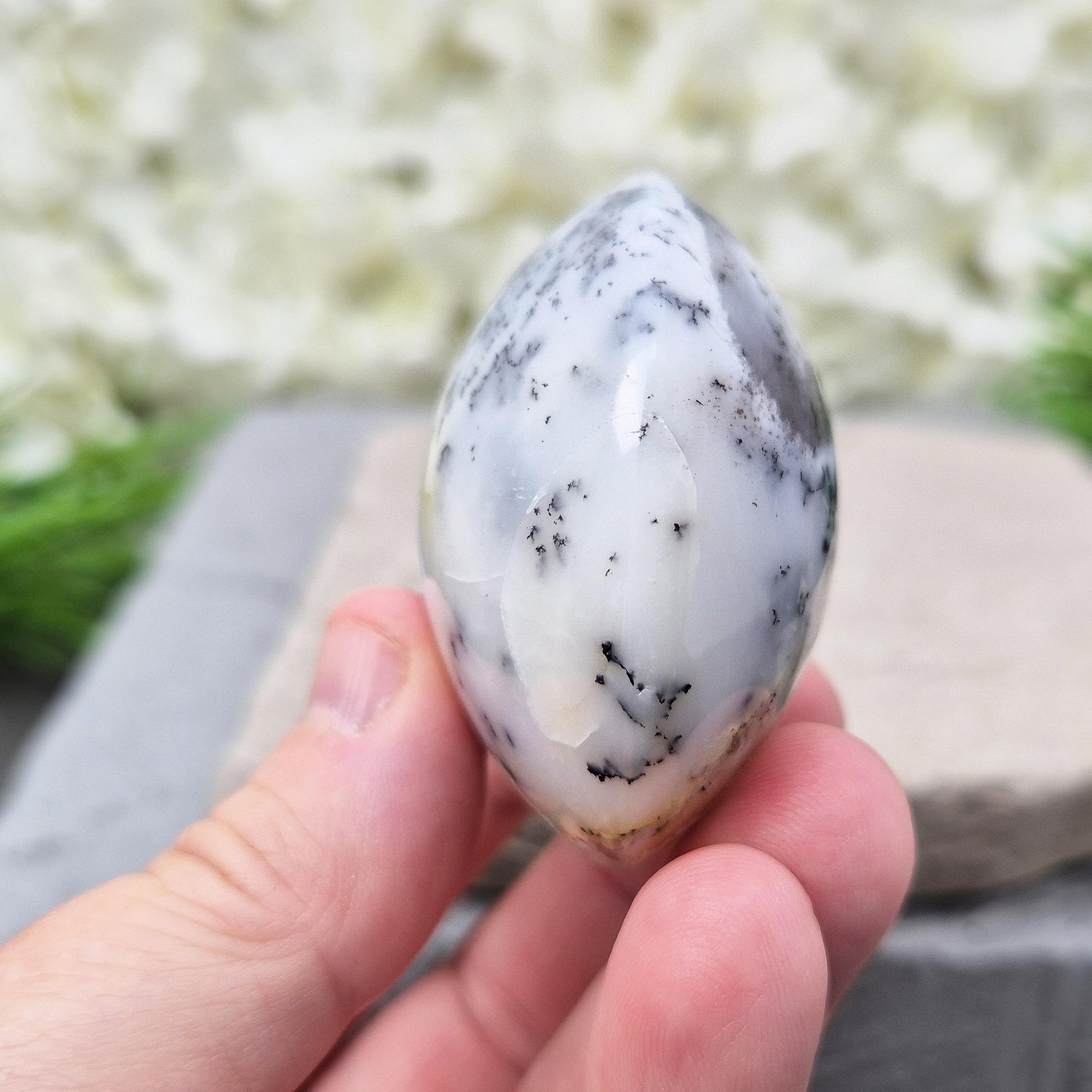 Polished Merlinite Galet from Madagascar. Supports focus, spiritual growth, and connection to ancient wisdom. Ideal for meditation and rituals. 