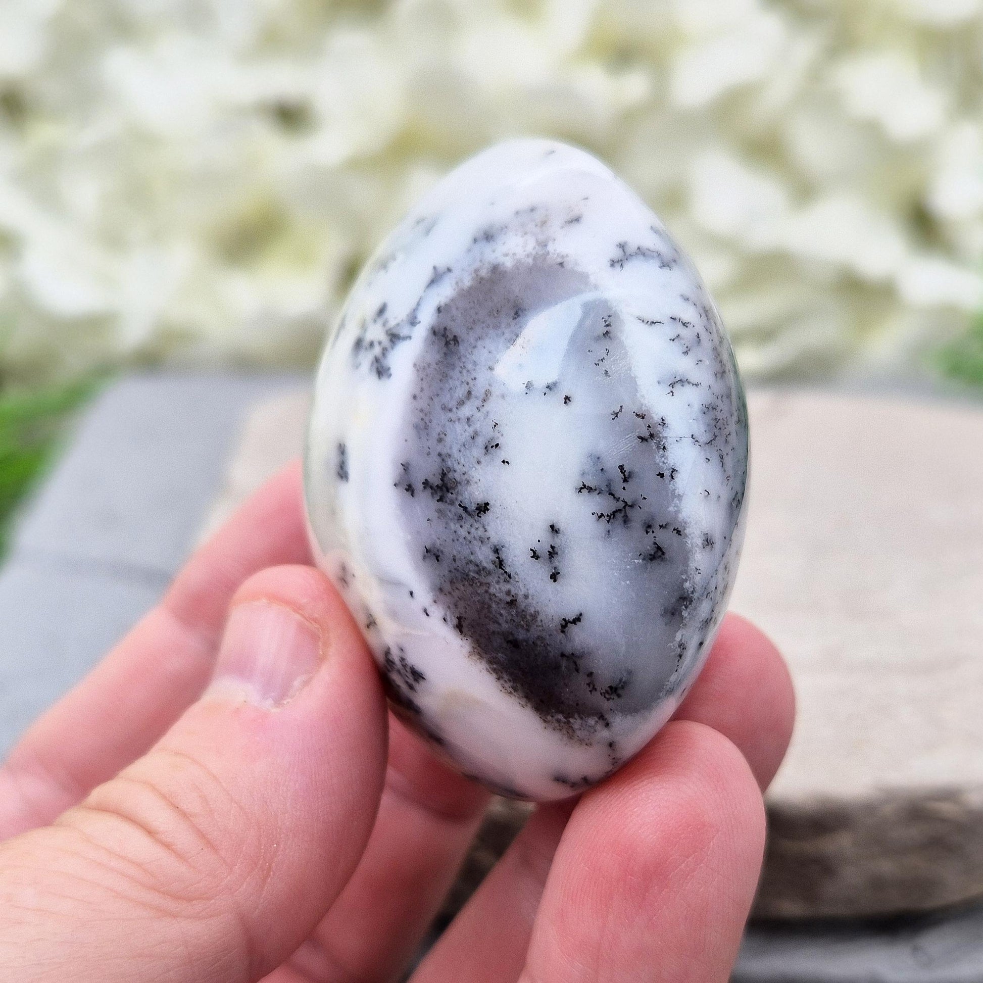 Polished Merlinite Galet from Madagascar. Supports focus, spiritual growth, and connection to ancient wisdom. Ideal for meditation and rituals. 