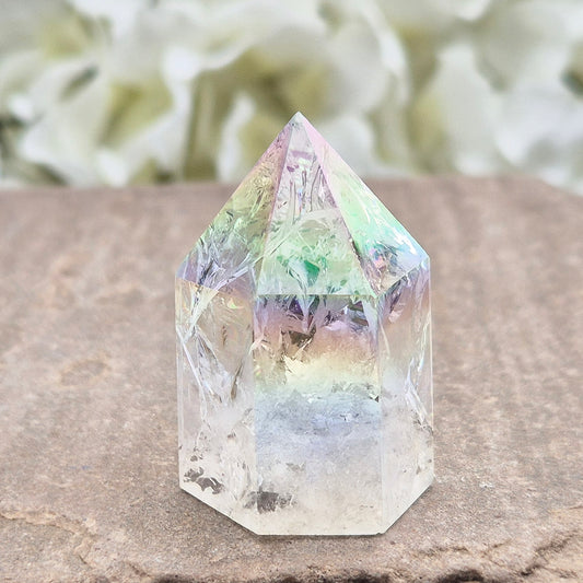 Aura Fire & Ice Quartz point with radiant rainbow flashes. Uplifting, self-cleansing crystal for meditation, intention and higher connection.