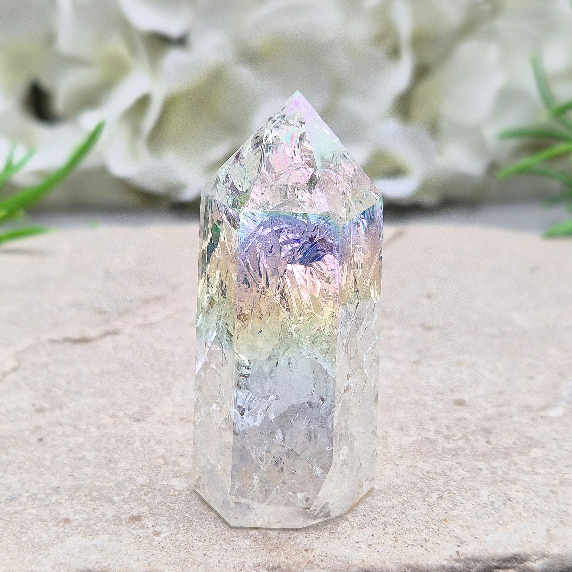 Aura Fire and Ice Quartz combines rainbow shimmer with powerful cleansing energy, balancing emotion, clarity, and spiritual light.