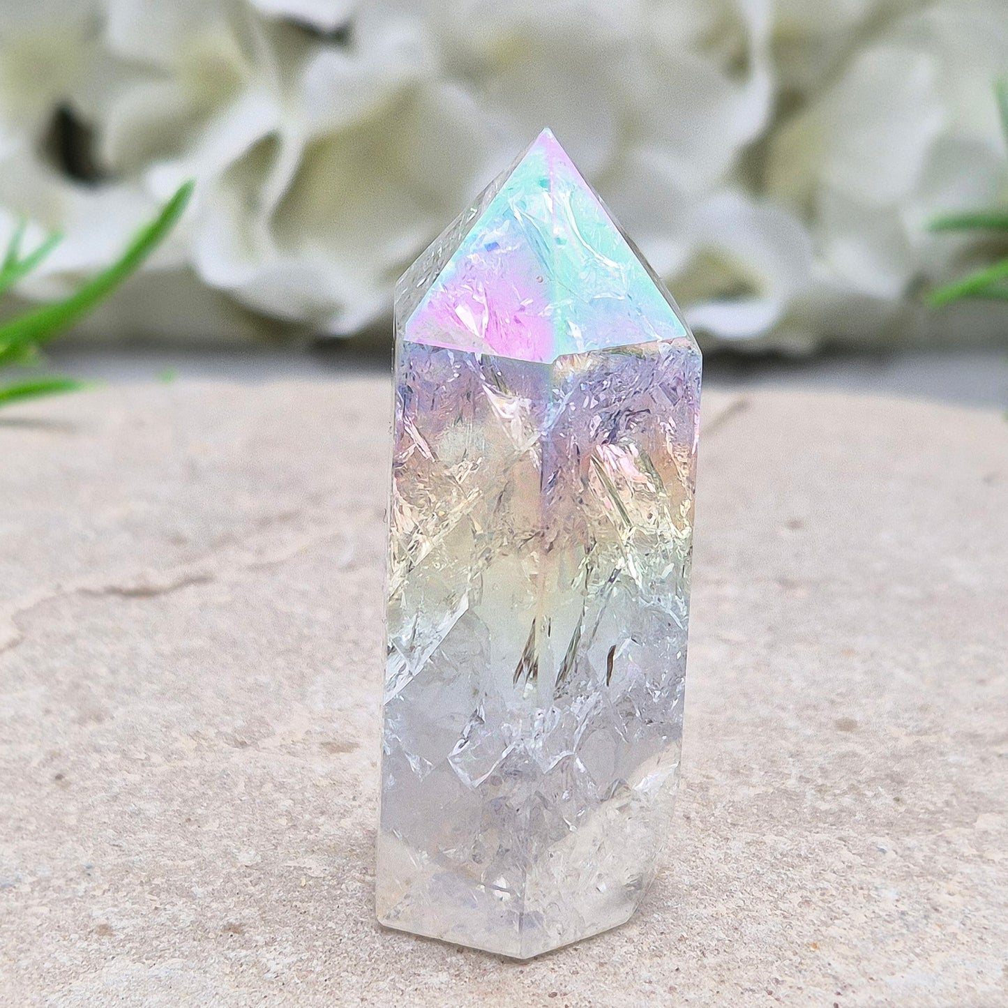 Aura Fire and Ice Quartz combines rainbow shimmer with powerful cleansing energy, balancing emotion, clarity, and spiritual light.