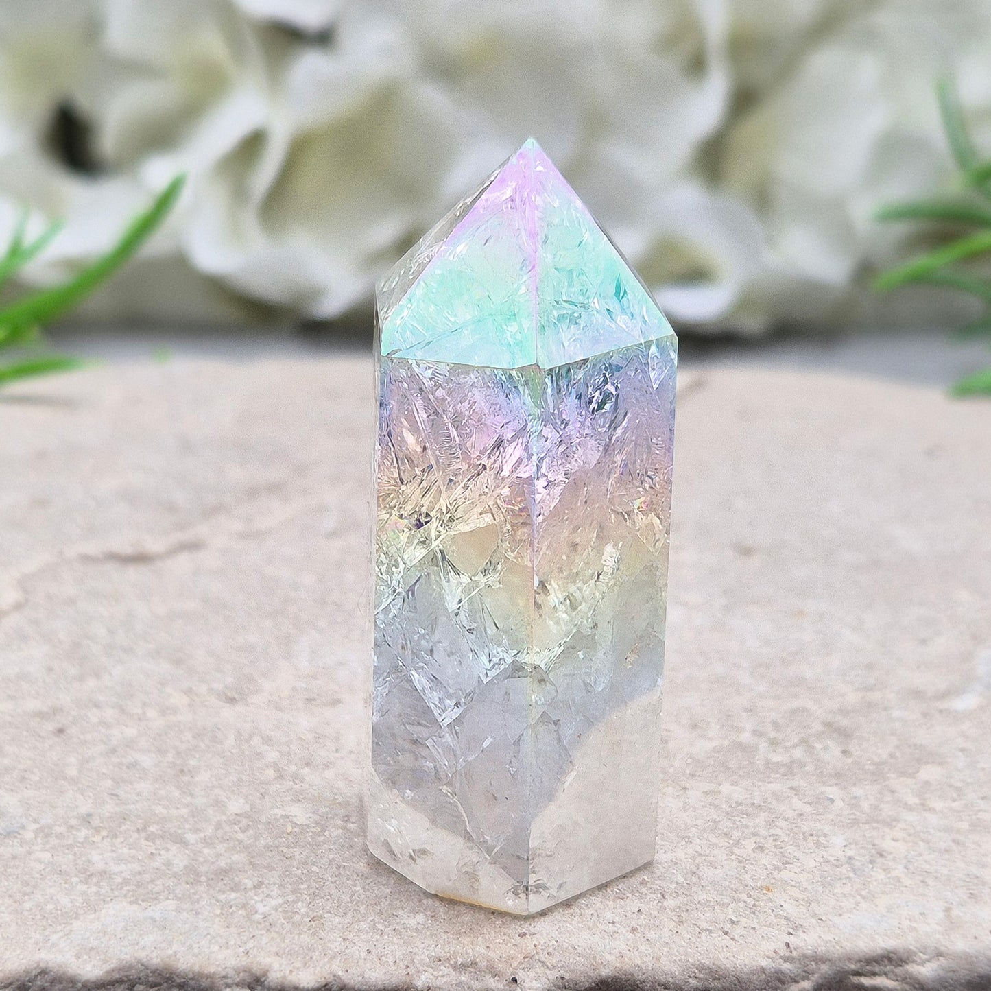 Aura Fire and Ice Quartz combines rainbow shimmer with powerful cleansing energy, balancing emotion, clarity, and spiritual light.