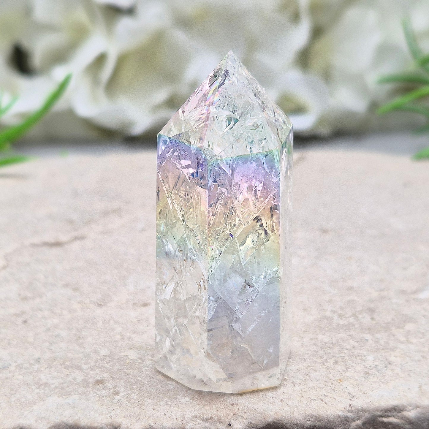 Aura Fire and Ice Quartz combines rainbow shimmer with powerful cleansing energy, balancing emotion, clarity, and spiritual light.