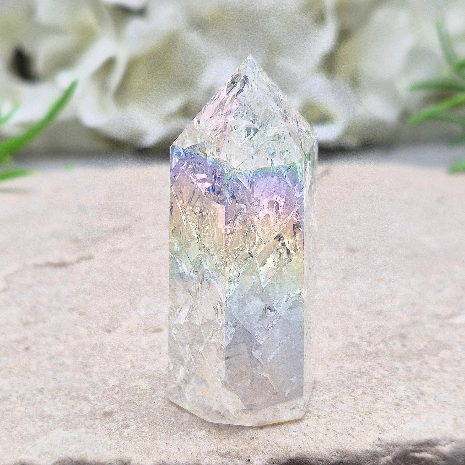 Aura Fire and Ice Quartz combines rainbow shimmer with powerful cleansing energy, balancing emotion, clarity, and spiritual light.