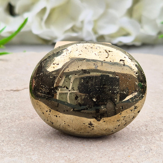 Sparkling Pyrite palmstone from Brazil. A crystal of protection, confidence, and focus—ideal for creativity, insight, and shielding from negativity.