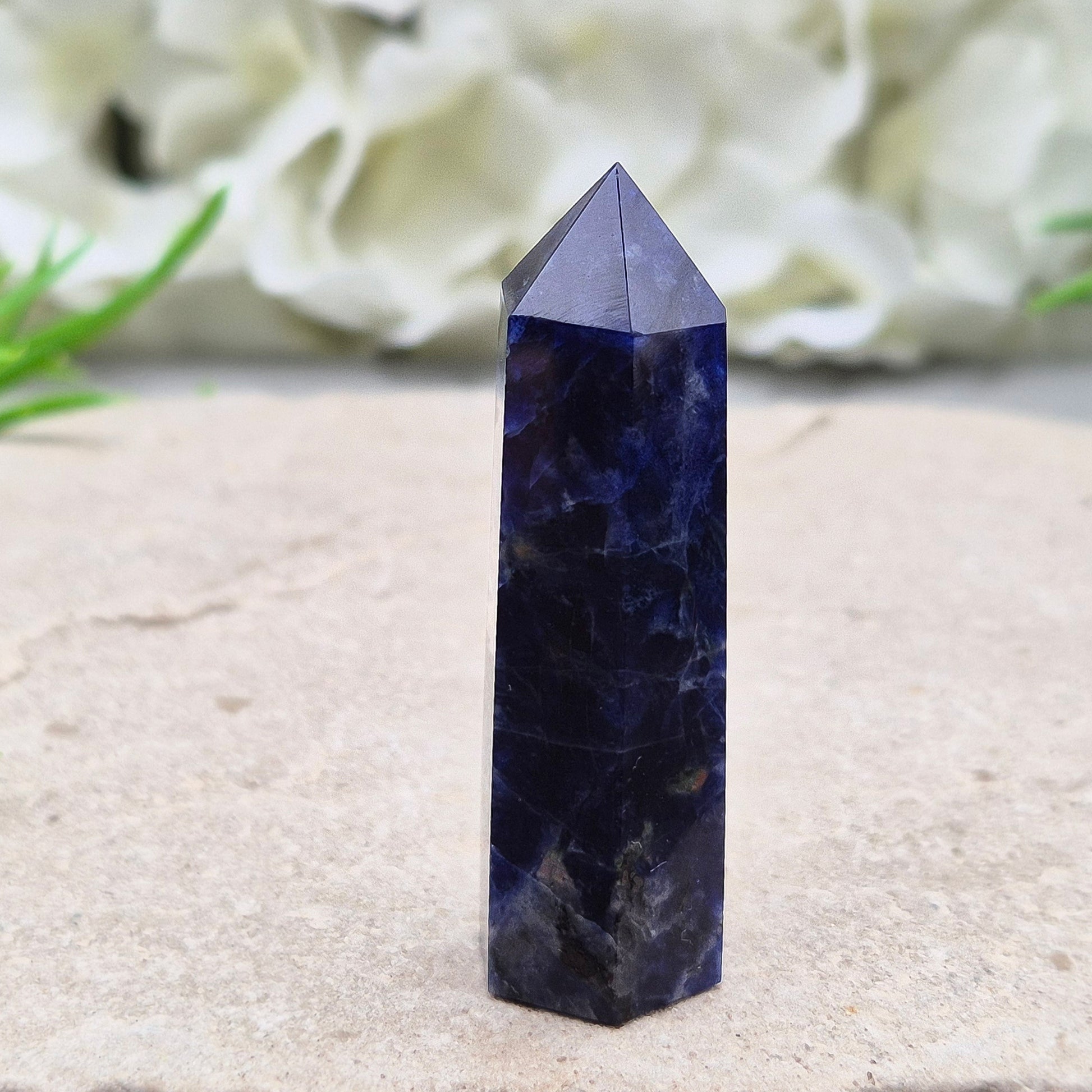 Beautiful Sodalite point that promotes insight, confidence, and inner peace. A grounding crystal for clear communication and self-expression.