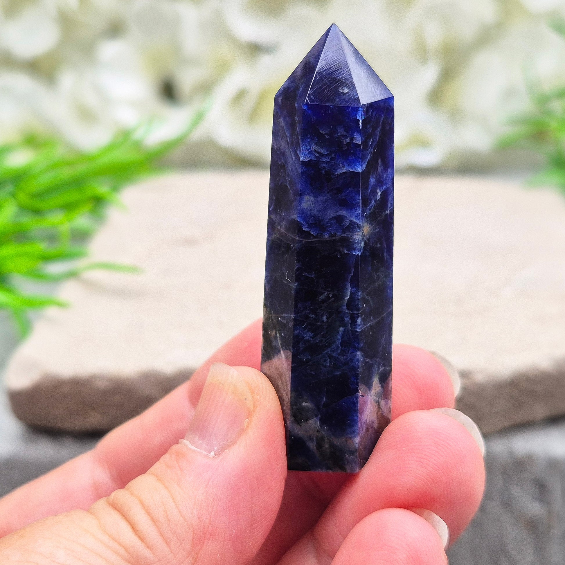 Beautiful Sodalite point that promotes insight, confidence, and inner peace. A grounding crystal for clear communication and self-expression.