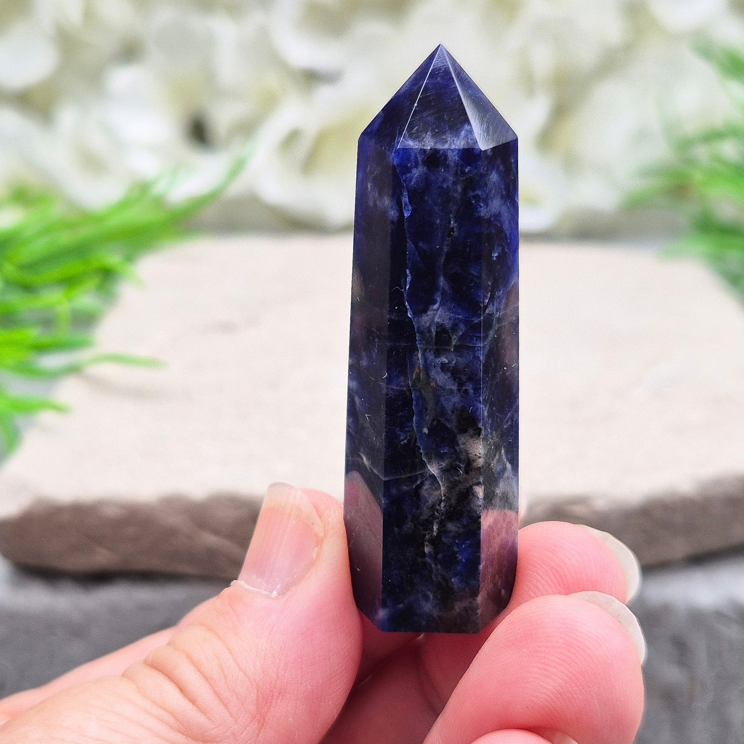 Beautiful Sodalite point that promotes insight, confidence, and inner peace. A grounding crystal for clear communication and self-expression.