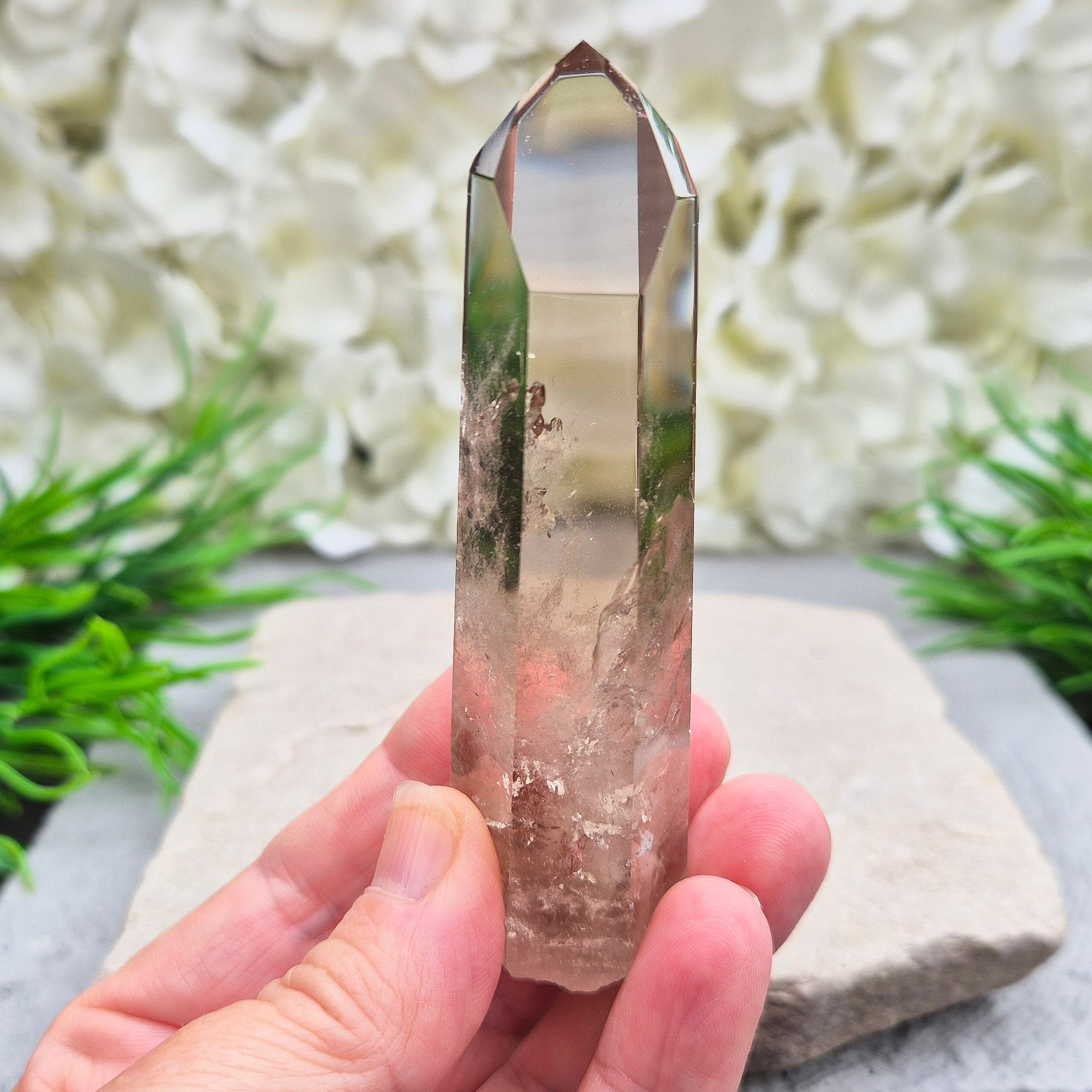 Natural Smoky Quartz crystal point — a powerful grounding stone for balance, protection, and letting go of unwanted energy.