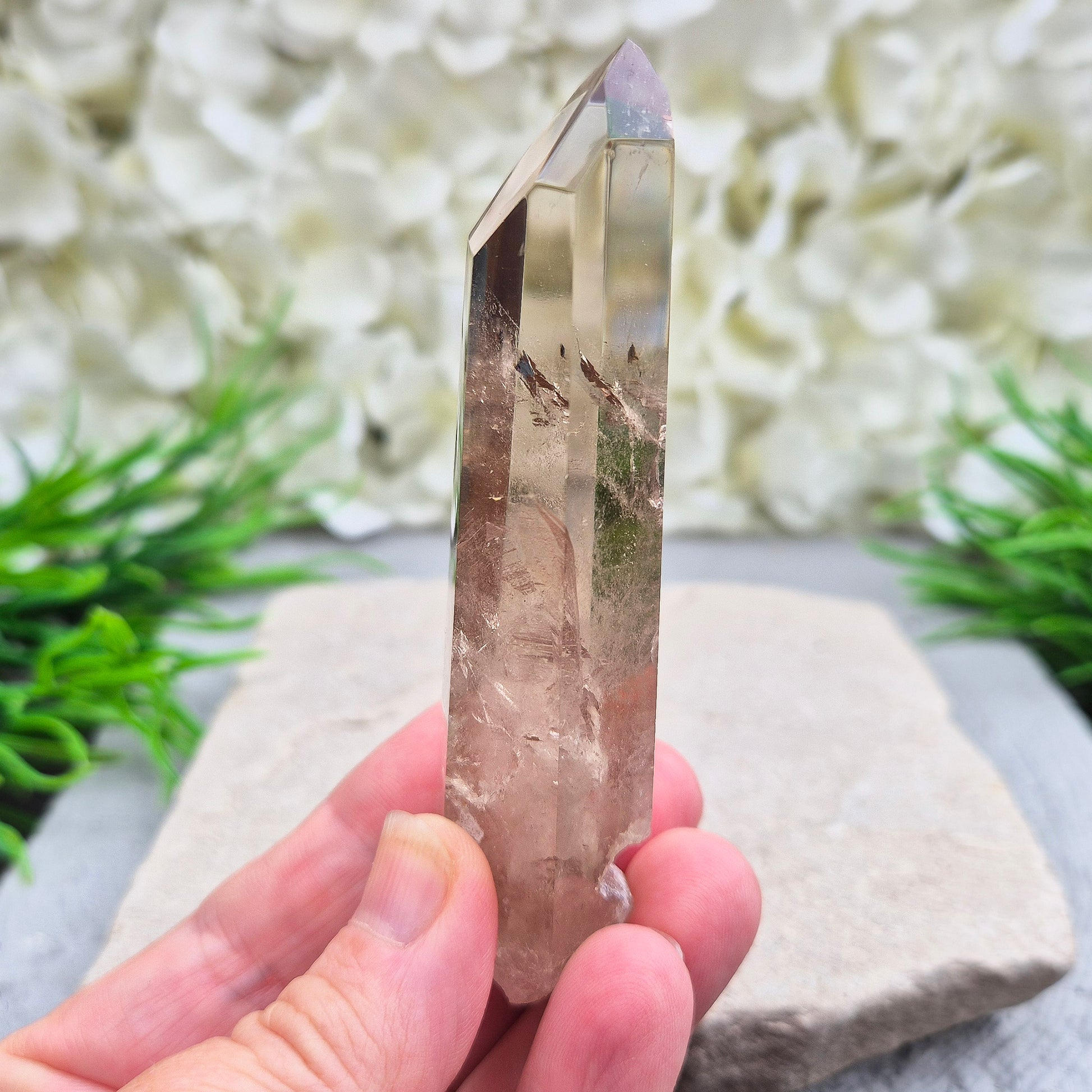 Natural Smoky Quartz crystal point — a powerful grounding stone for balance, protection, and letting go of unwanted energy.