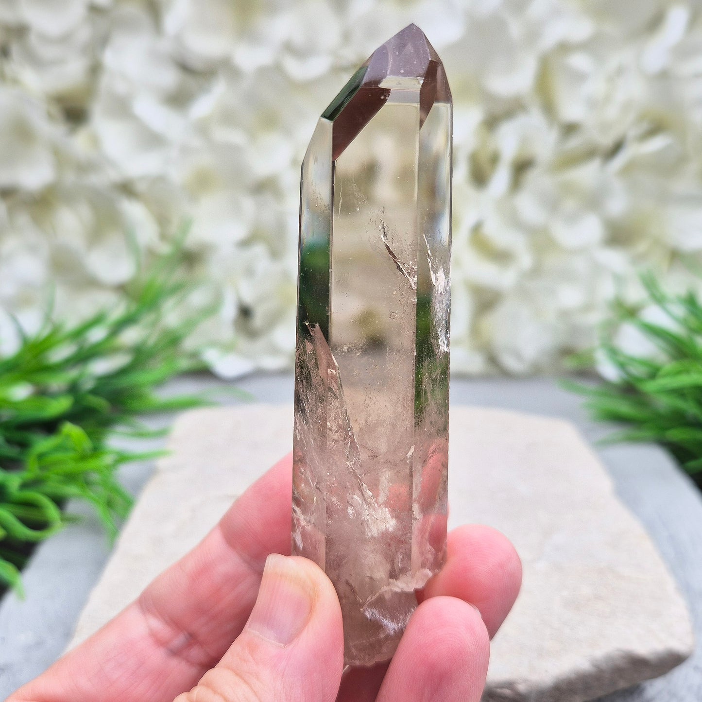 Natural Smoky Quartz crystal point — a powerful grounding stone for balance, protection, and letting go of unwanted energy.