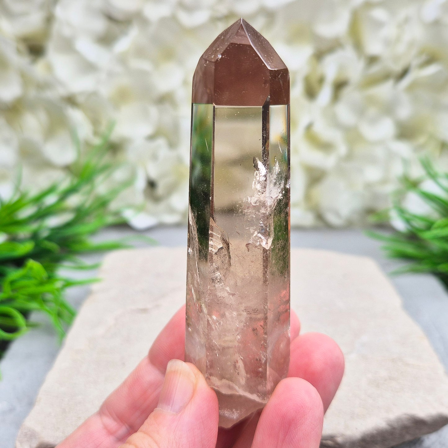 Natural Smoky Quartz crystal point — a powerful grounding stone for balance, protection, and letting go of unwanted energy.