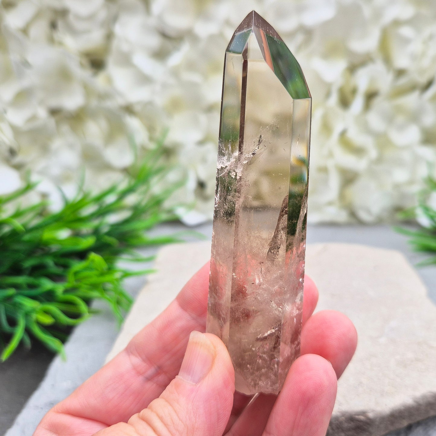 Natural Smoky Quartz crystal point — a powerful grounding stone for balance, protection, and letting go of unwanted energy.