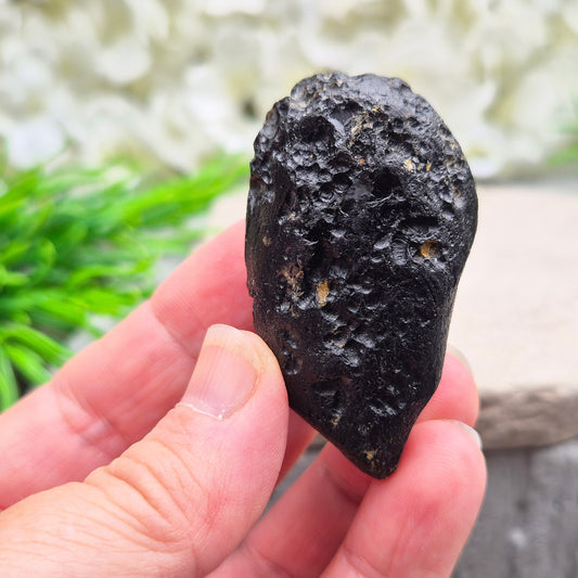 Powerful Black Tektite for grounding and transformation. A meteorite-born crystal that supports spiritual growth and energetic protection.