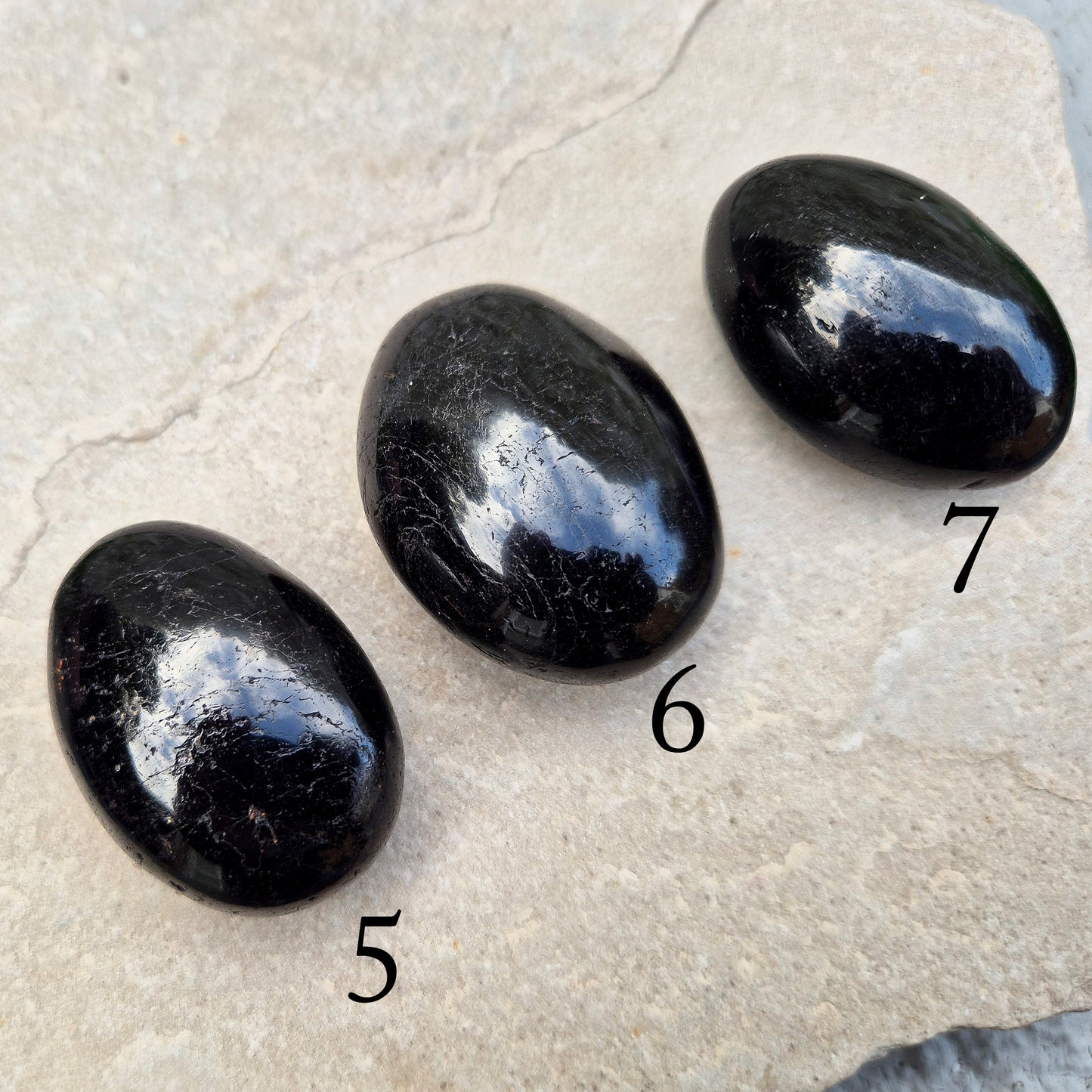 Grounding and protective palm stone for everyday energy support. Ideal for shielding from negativity and promoting inner strength. Hand-selected crystal.