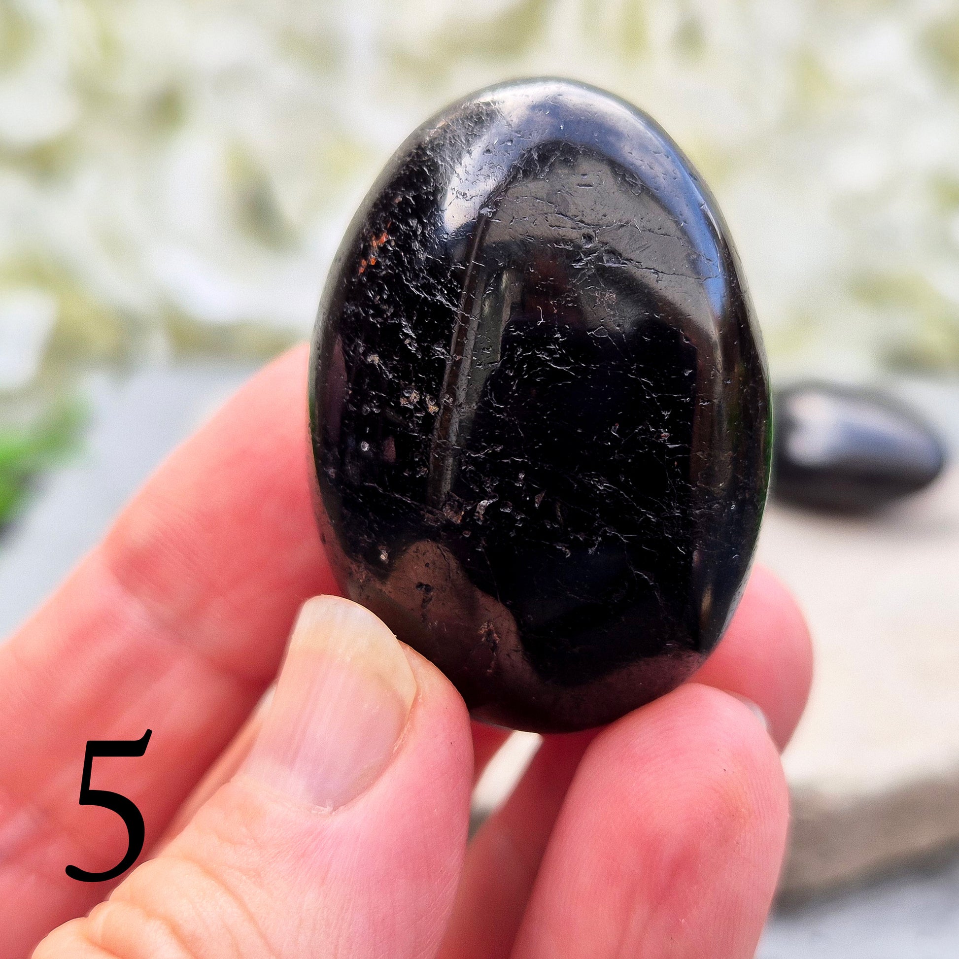 Grounding and protective palm stone for everyday energy support. Ideal for shielding from negativity and promoting inner strength. Hand-selected crystal.
