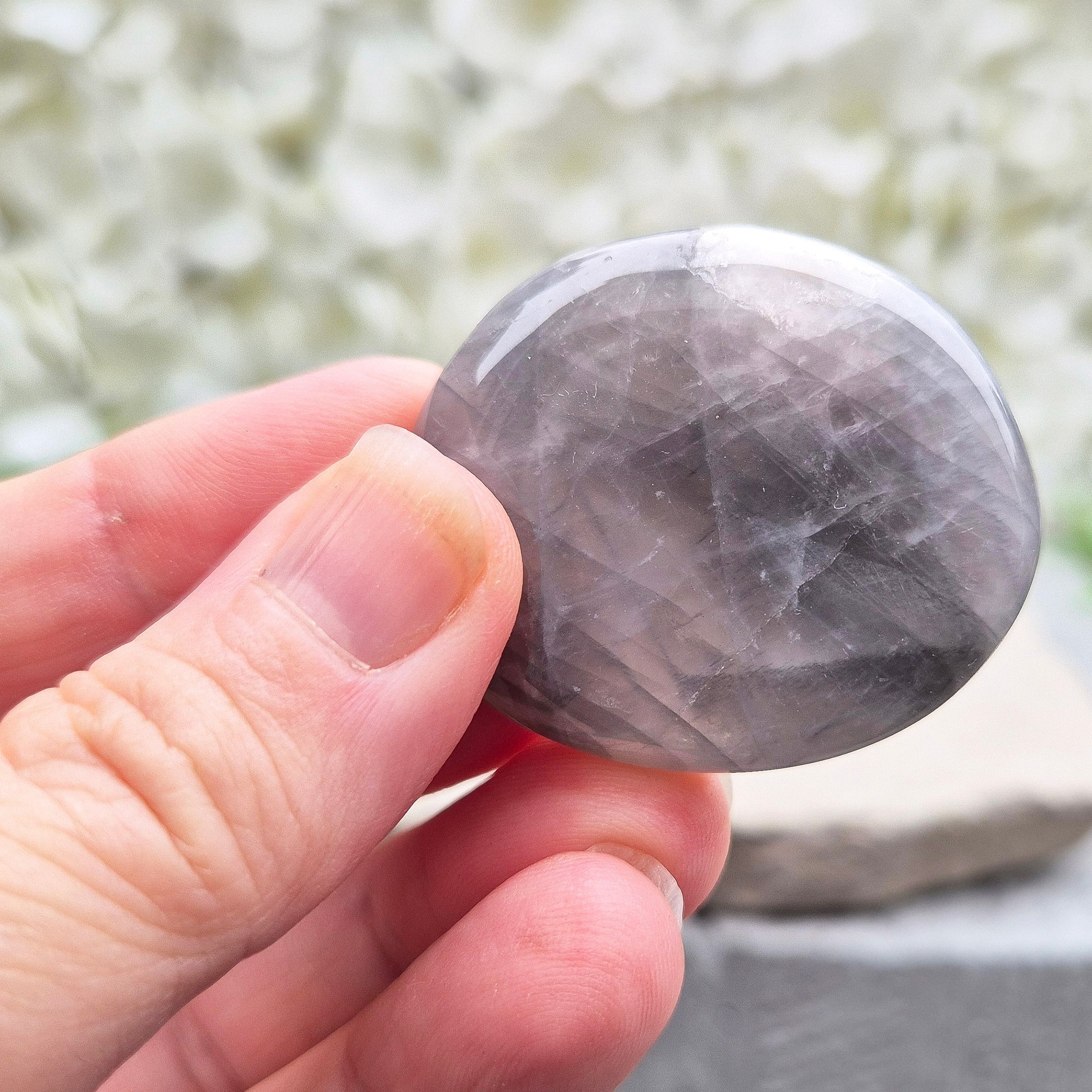 Shop Lunar Quartz palm stones. Boost confidence, ease emotions, and feel more connected to your inner guidance with this soothing crystal.