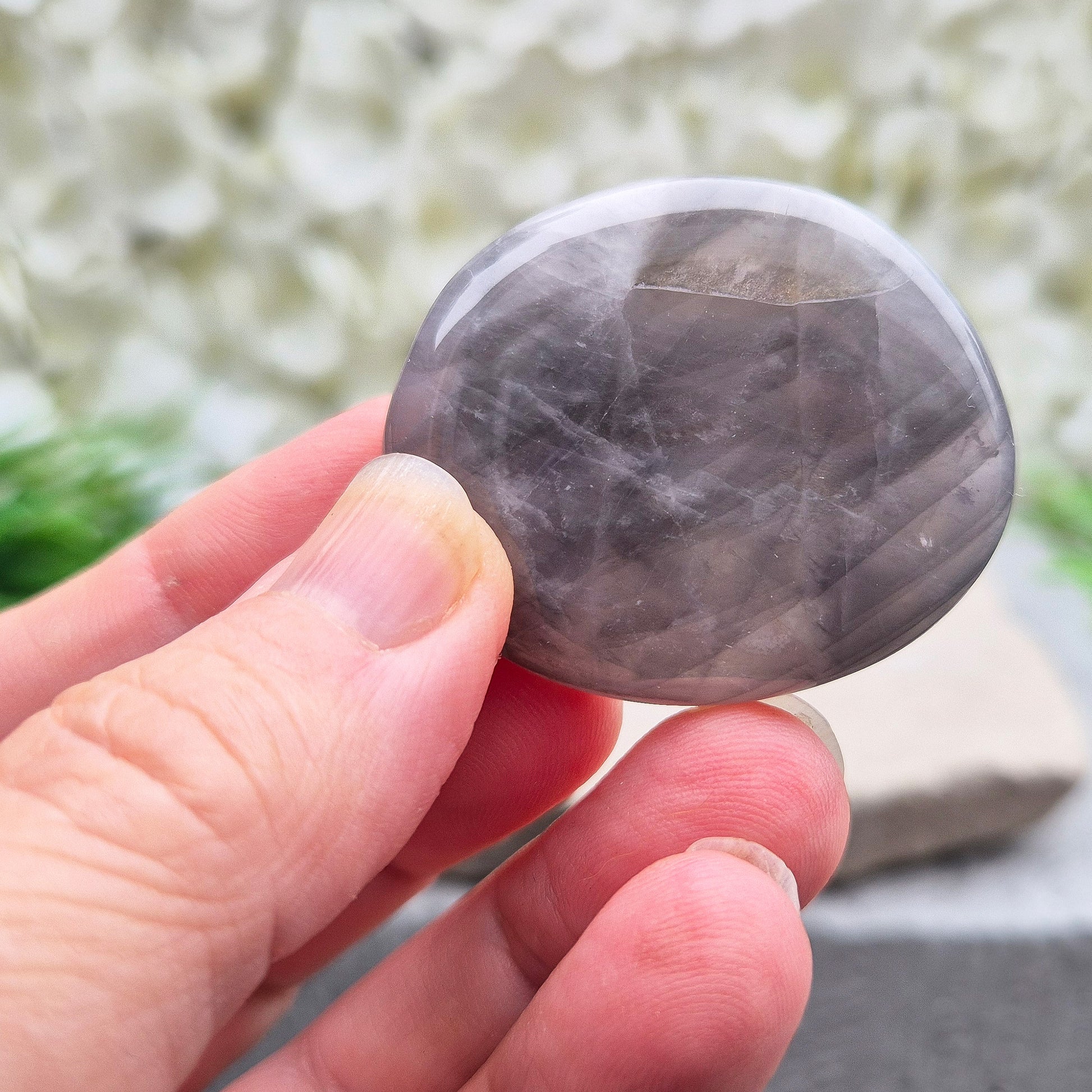 Shop Lunar Quartz palm stones. Boost confidence, ease emotions, and feel more connected to your inner guidance with this soothing crystal.