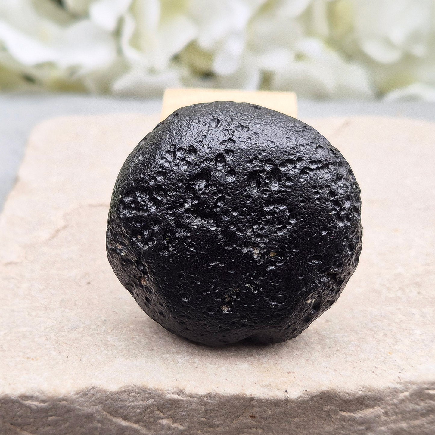 Genuine Black Tektite for grounding and energetic protection. Formed from ancient meteorite impacts. Ideal for meditation and aura clearing.