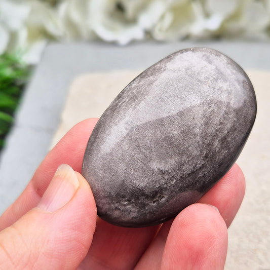 Grounding and protective Silver Sheen Obsidian crystal that enhances self-awareness, inner strength, and emotional balance.