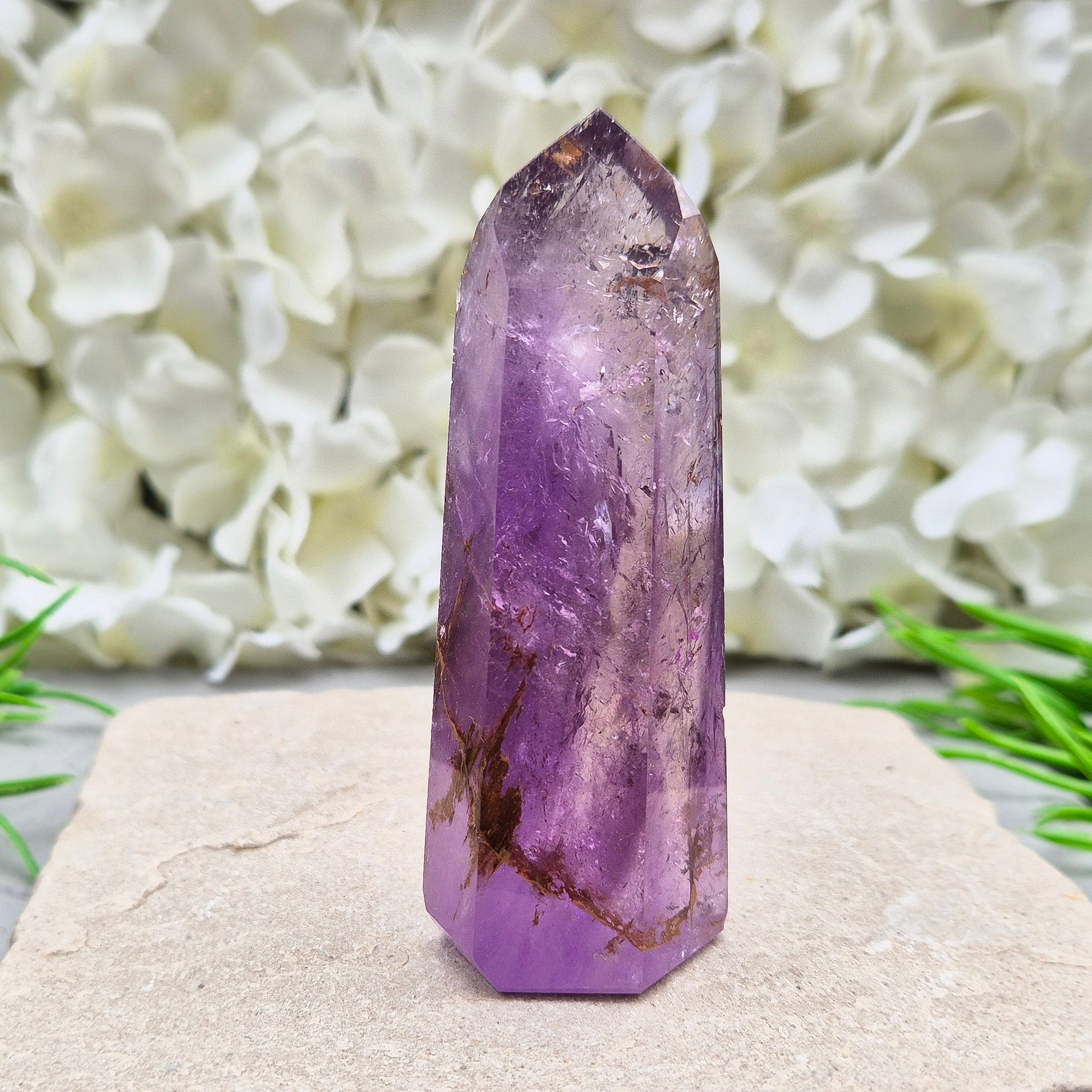 Amethyst Tower with Iron Ore Inclusions – calming, protective energy for peace and balance. Ideal for meditation, home harmony, and emotional support.