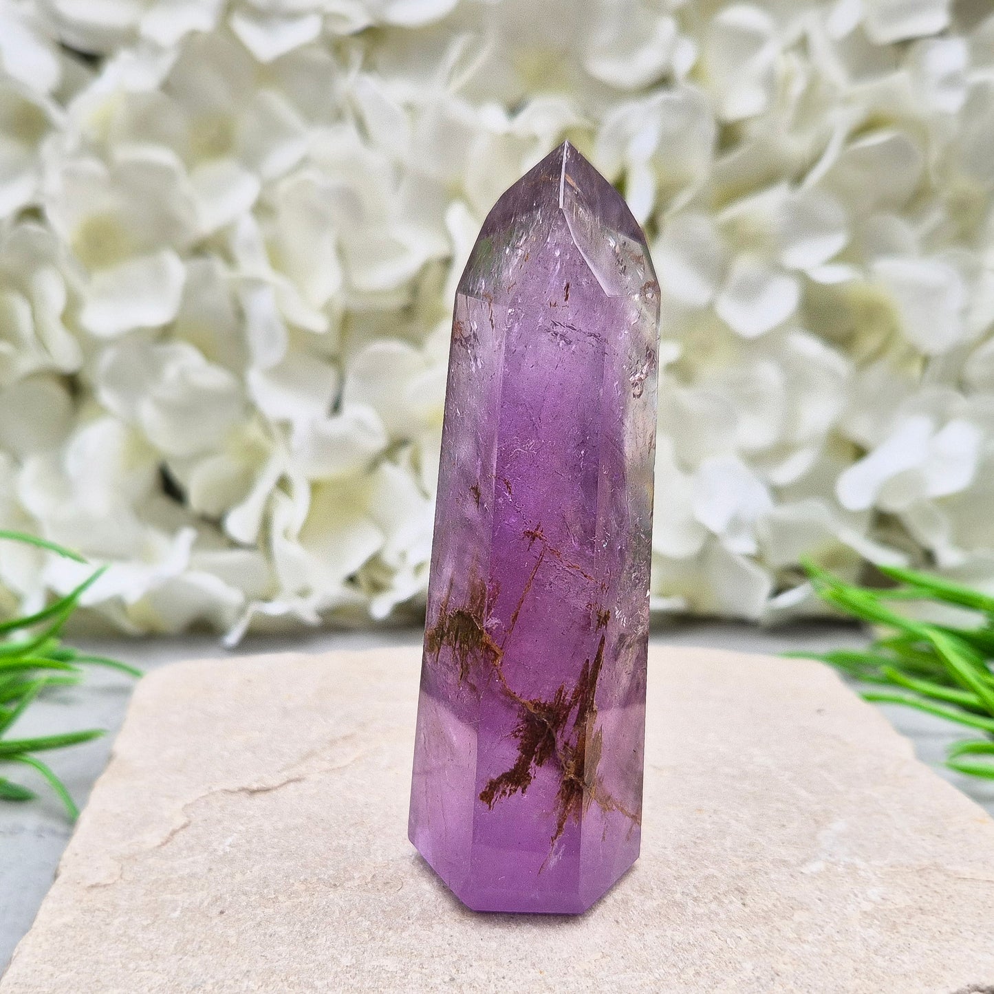 Amethyst Tower with Iron Ore Inclusions – calming, protective energy for peace and balance. Ideal for meditation, home harmony, and emotional support.