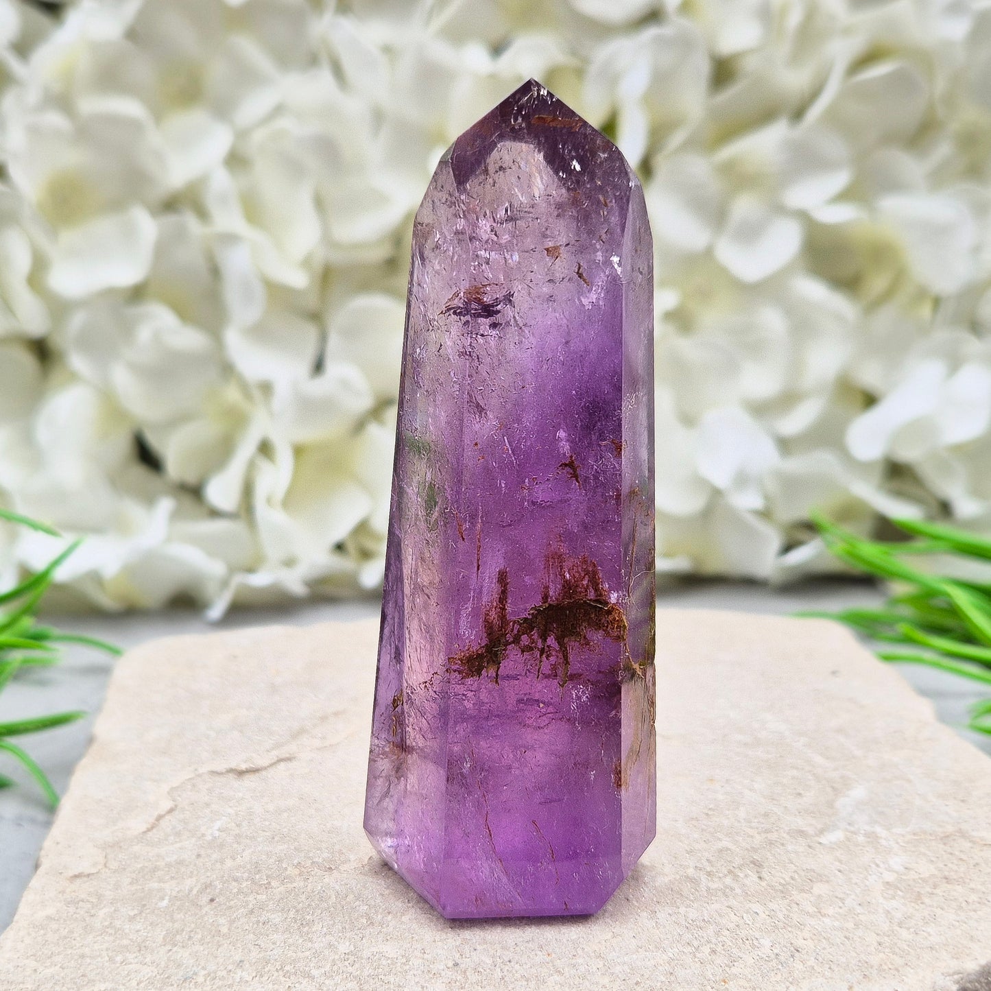 Amethyst Tower with Iron Ore Inclusions – calming, protective energy for peace and balance. Ideal for meditation, home harmony, and emotional support.