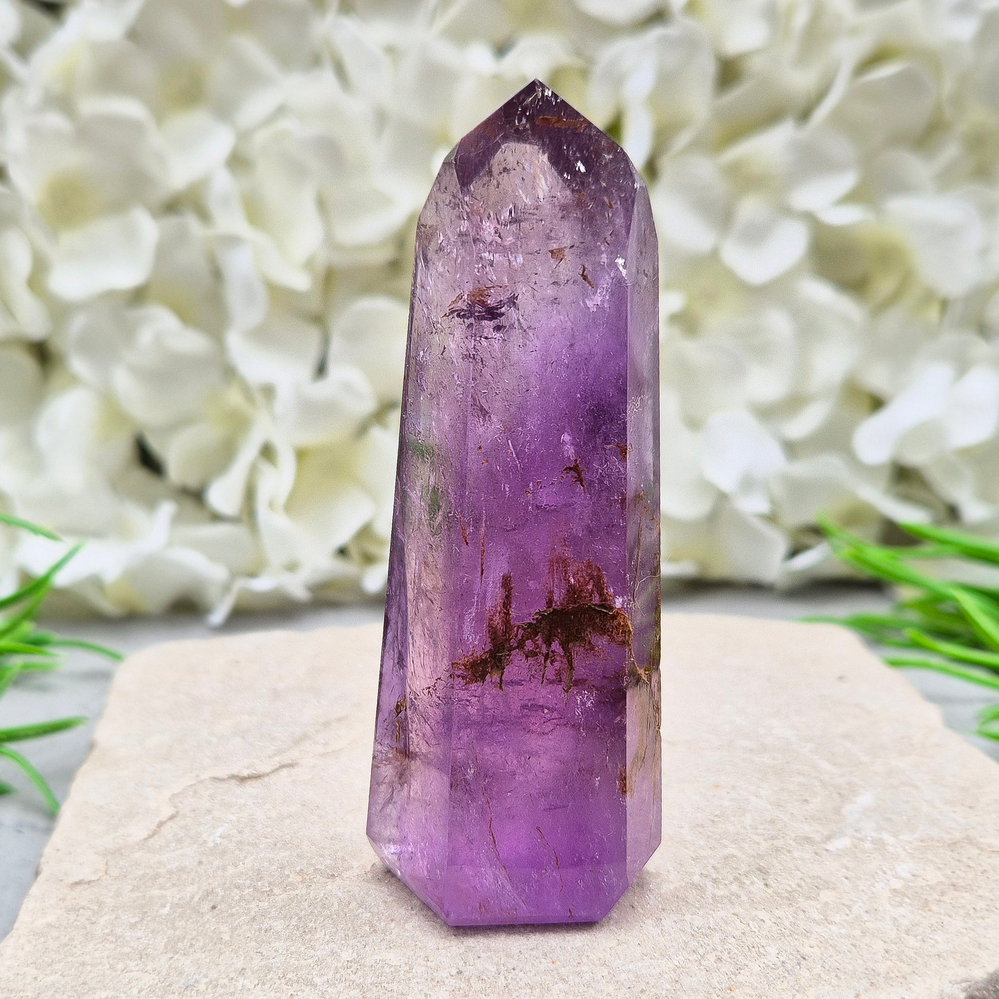 Amethyst Tower with Iron Ore Inclusions – calming, protective energy for peace and balance. Ideal for meditation, home harmony, and emotional support.