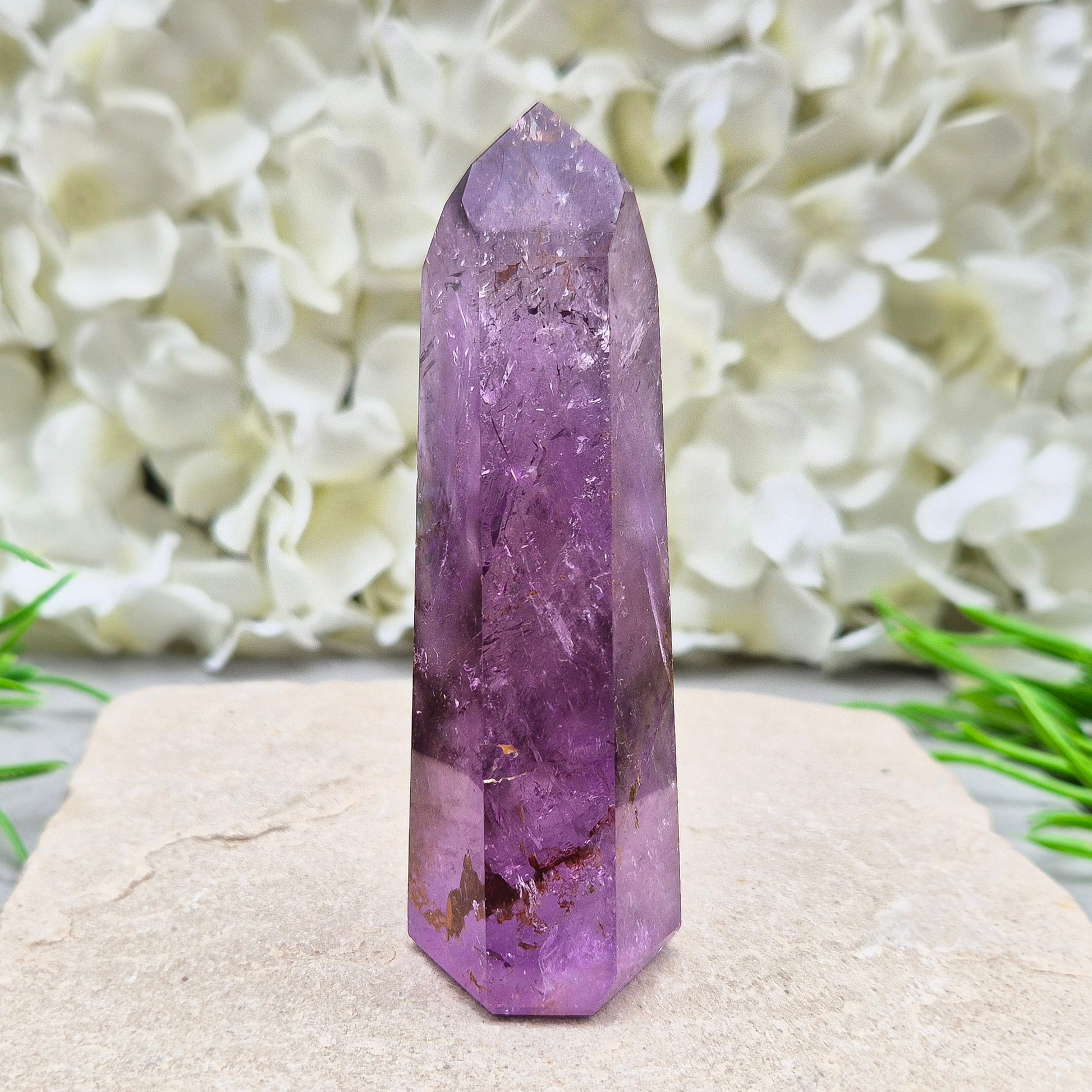 Amethyst Tower with Iron Ore Inclusions – calming, protective energy for peace and balance. Ideal for meditation, home harmony, and emotional support.