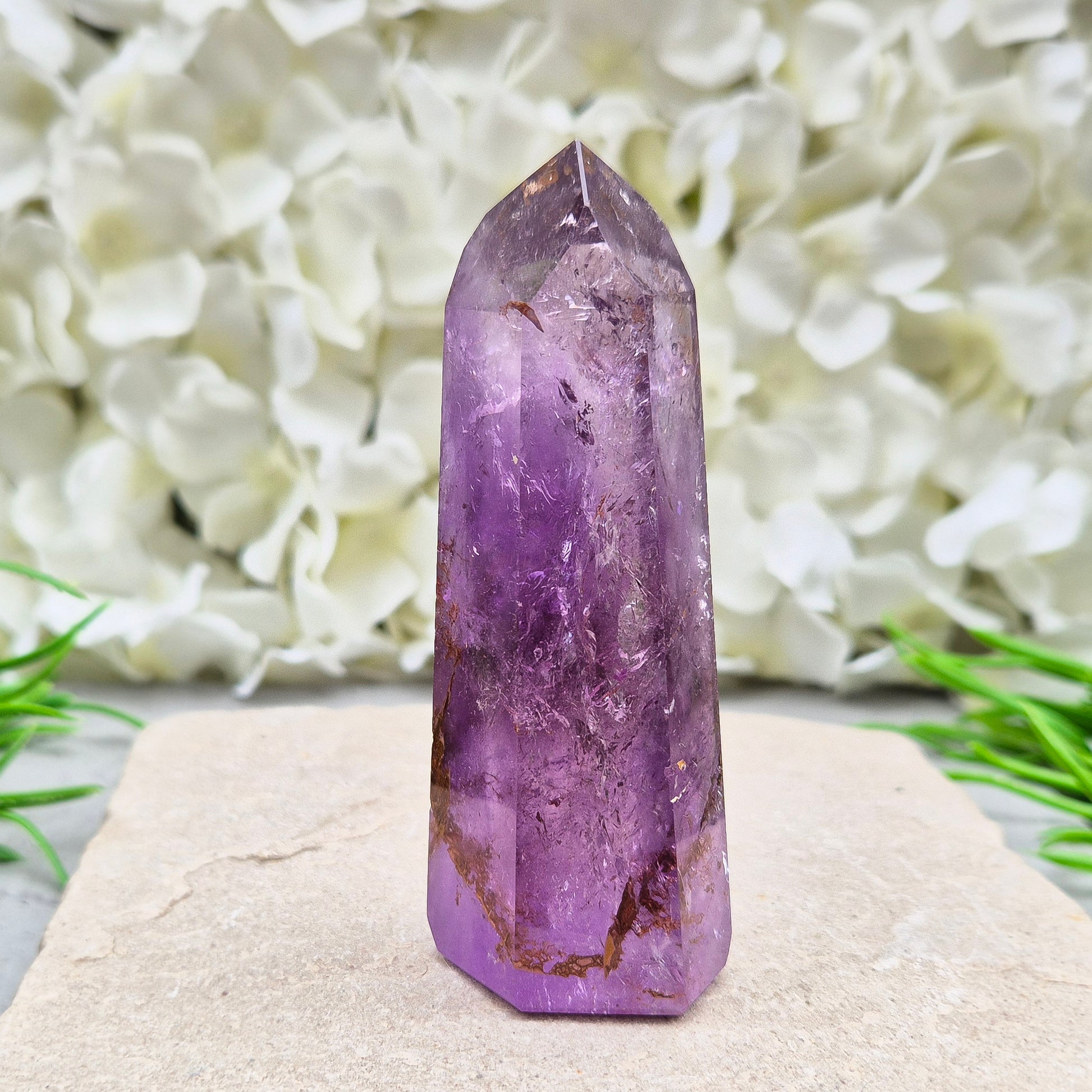 Amethyst Tower with Iron Ore Inclusions – calming, protective energy for peace and balance. Ideal for meditation, home harmony, and emotional support.
