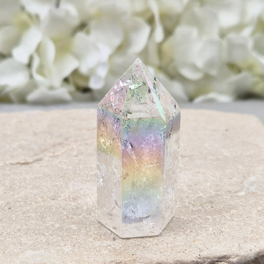 Aura Fire & Ice Quartz crystal point with radiant rainbow flashes. Uplifting, self-cleansing crystal for meditation, intention and higher connection.
