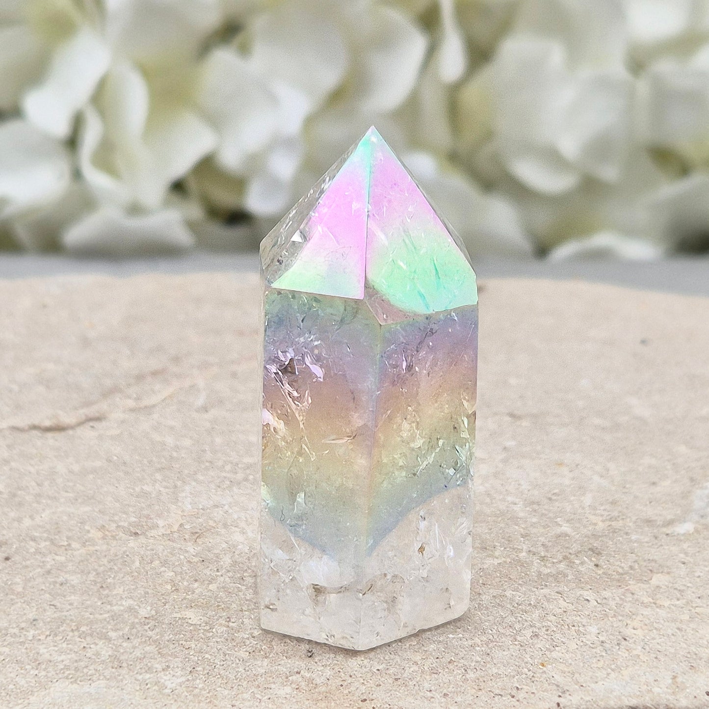 Aura Fire and Ice Quartz standing point with rainbow flashes and iridescent finish. A bright crystal for uplifting spaces, clearer thinking, and spiritual work.
