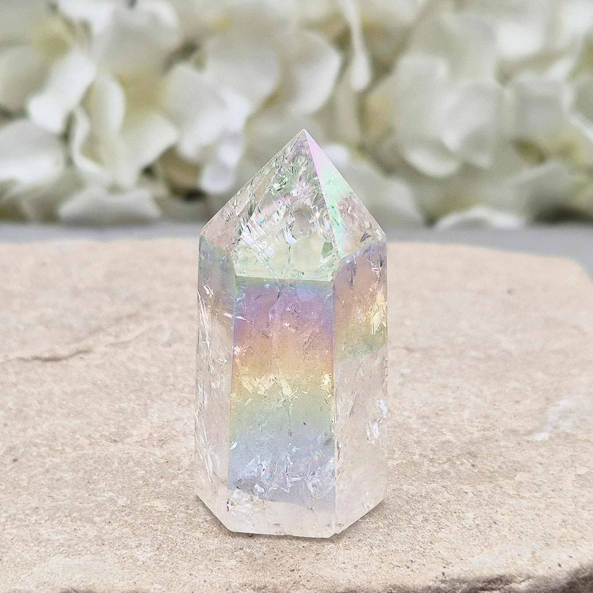 Aura Fire and Ice Quartz standing point with rainbow flashes and iridescent finish. A bright crystal for uplifting spaces, clearer thinking, and spiritual work.