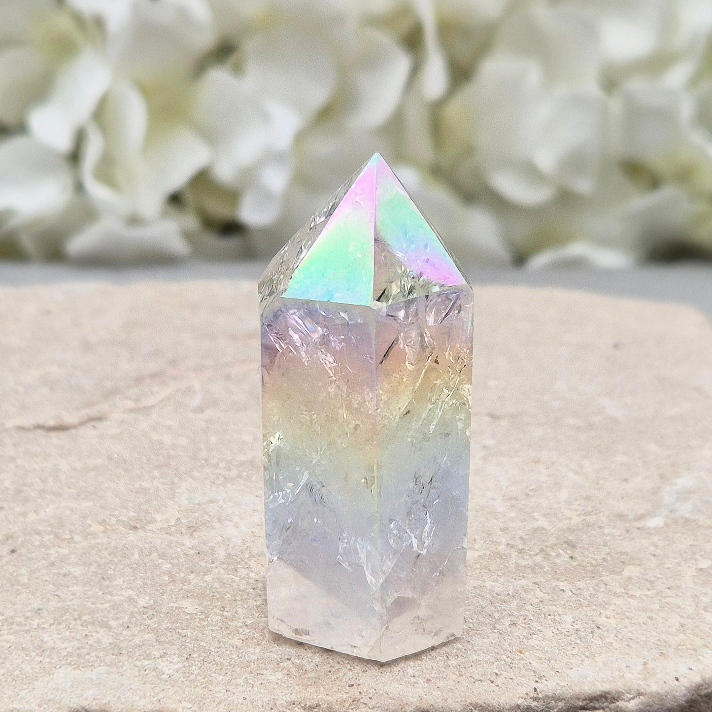Aura Fire and Ice Quartz standing point with rainbow flashes and iridescent finish. A bright crystal for uplifting spaces, clearer thinking, and spiritual work.