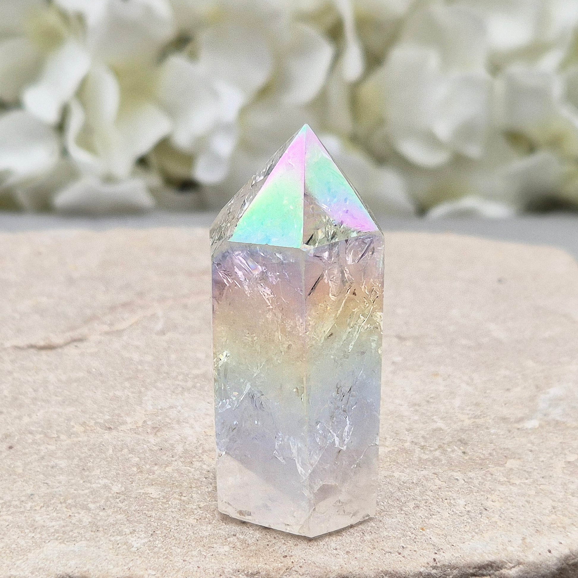 Aura Fire and Ice Quartz standing point with rainbow flashes and iridescent finish. A bright crystal for uplifting spaces, clearer thinking, and spiritual work.
