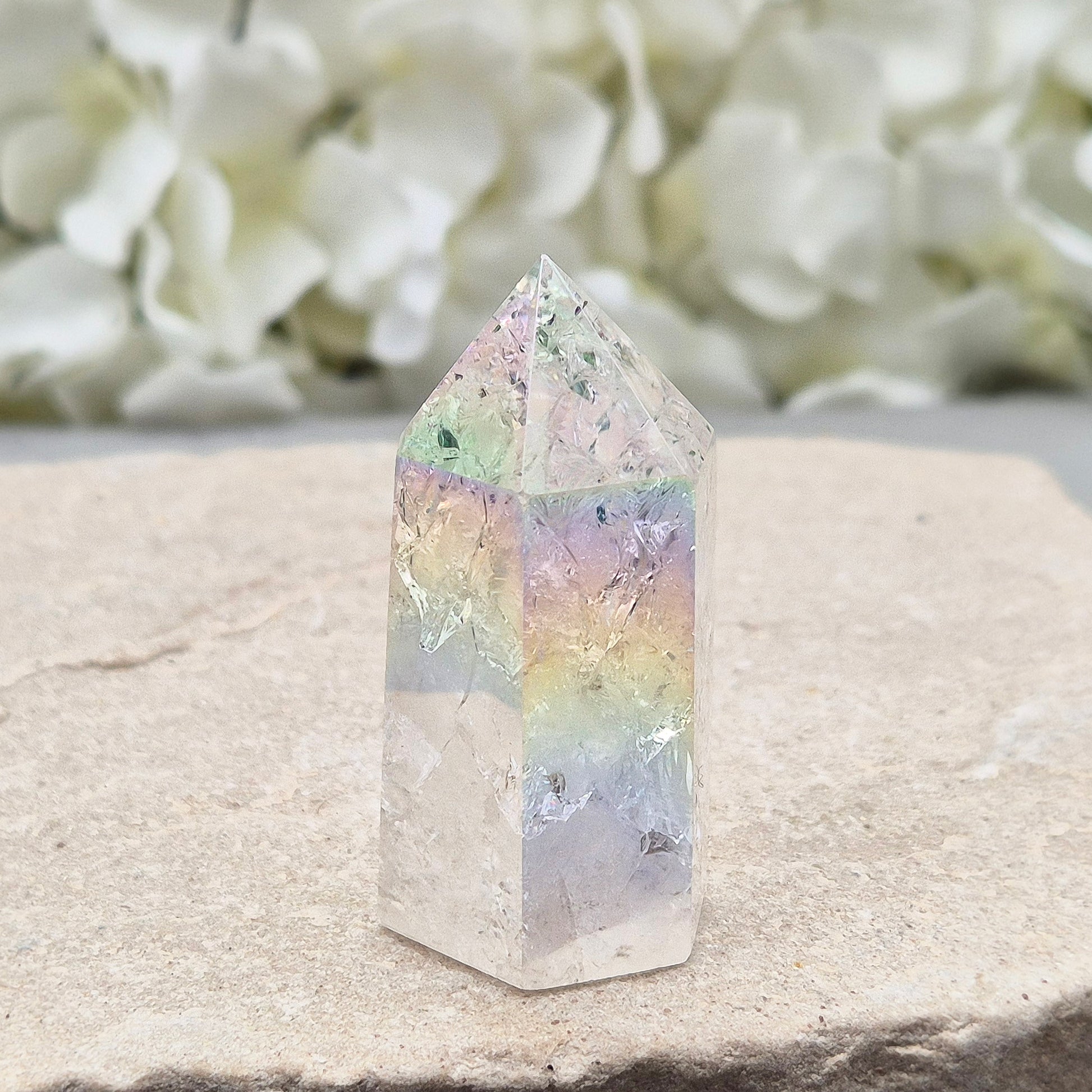 Aura Fire and Ice Quartz standing point with rainbow flashes and iridescent finish. A bright crystal for uplifting spaces, clearer thinking, and spiritual work.