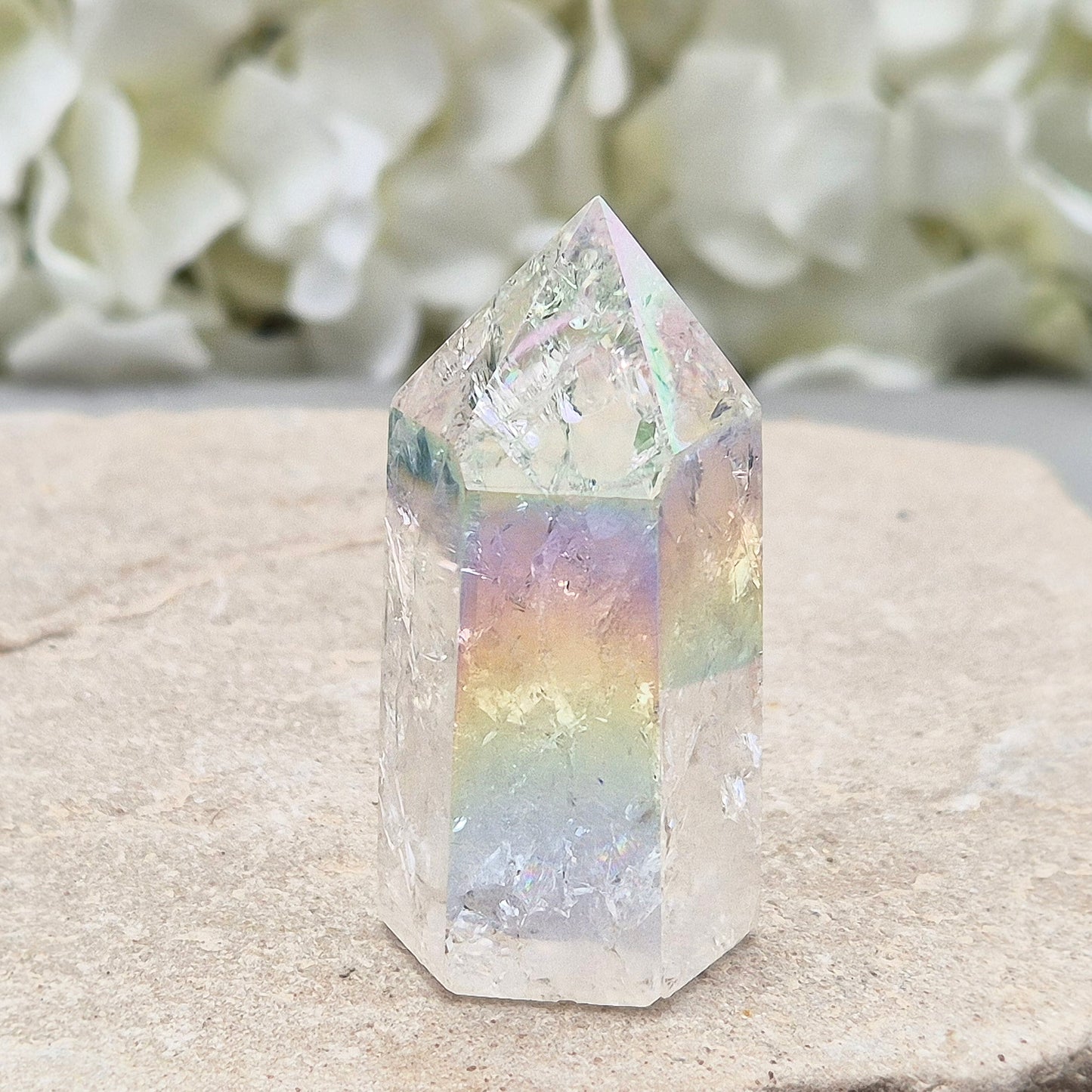 Aura Fire and Ice Quartz standing point with rainbow flashes and iridescent finish. A bright crystal for uplifting spaces, clearer thinking, and spiritual work.