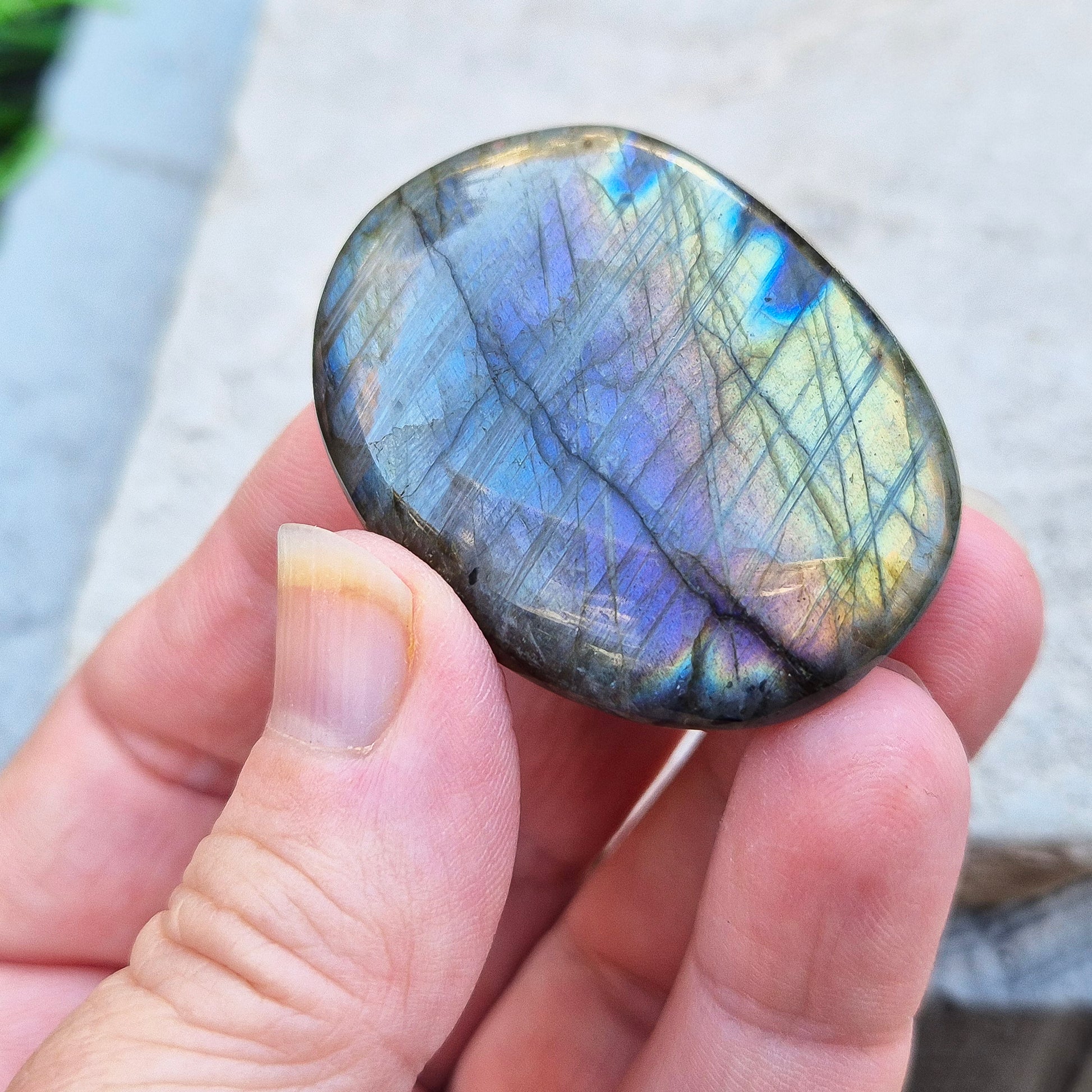 Mystical Labradorite palm stone from Madagascar with vibrant flash. Supports intuition, aura protection & energy clearing. Pocket-sized crystal.