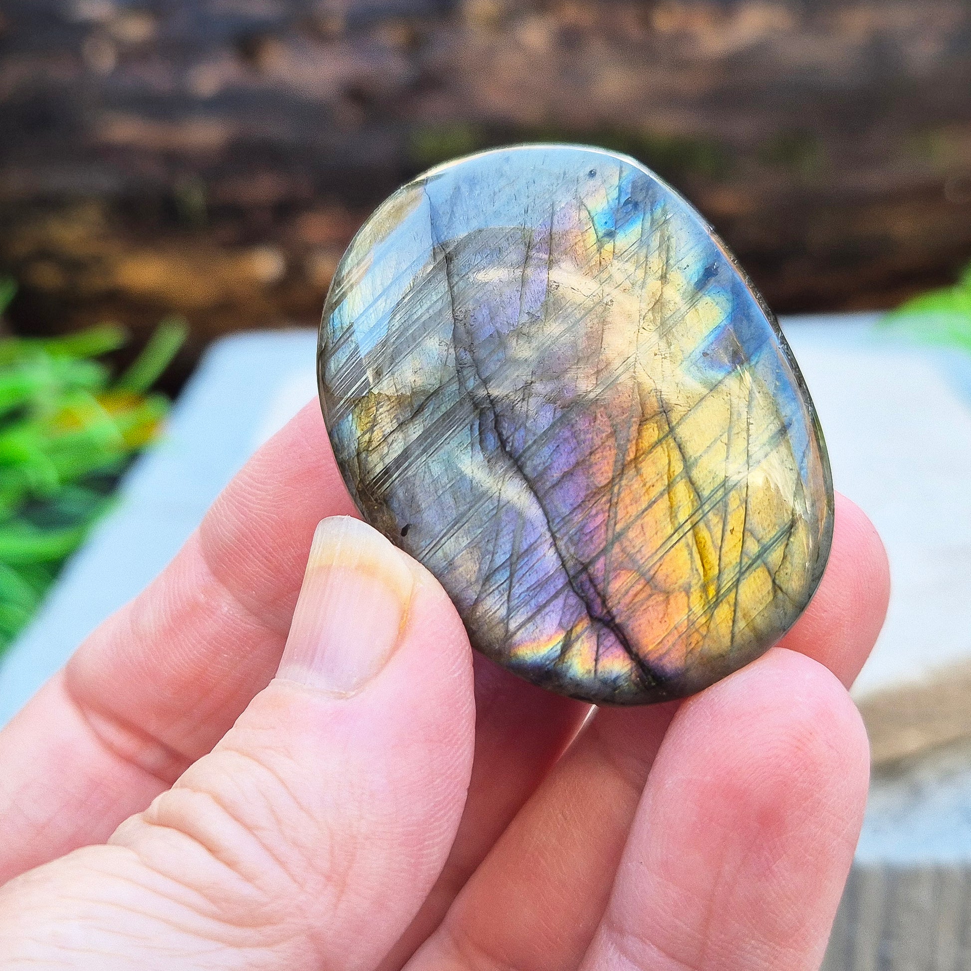 Mystical Labradorite palm stone from Madagascar with vibrant flash. Supports intuition, aura protection & energy clearing. Pocket-sized crystal.