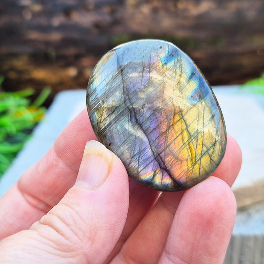Mystical Labradorite palm stone from Madagascar with vibrant flash. Supports intuition, aura protection & energy clearing. Pocket-sized crystal.