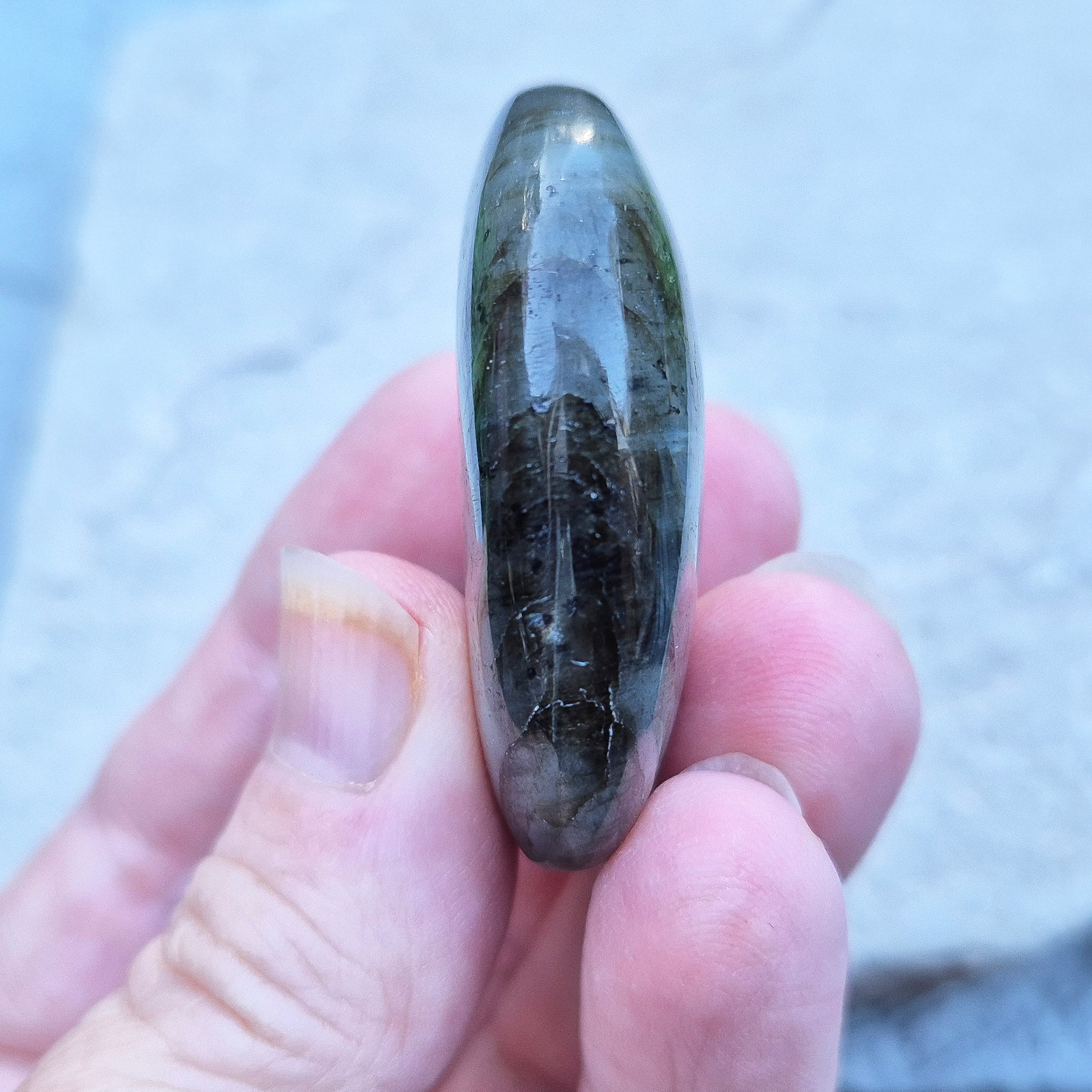 Mystical Labradorite palm stone from Madagascar with vibrant flash. Supports intuition, aura protection & energy clearing. Pocket-sized crystal.