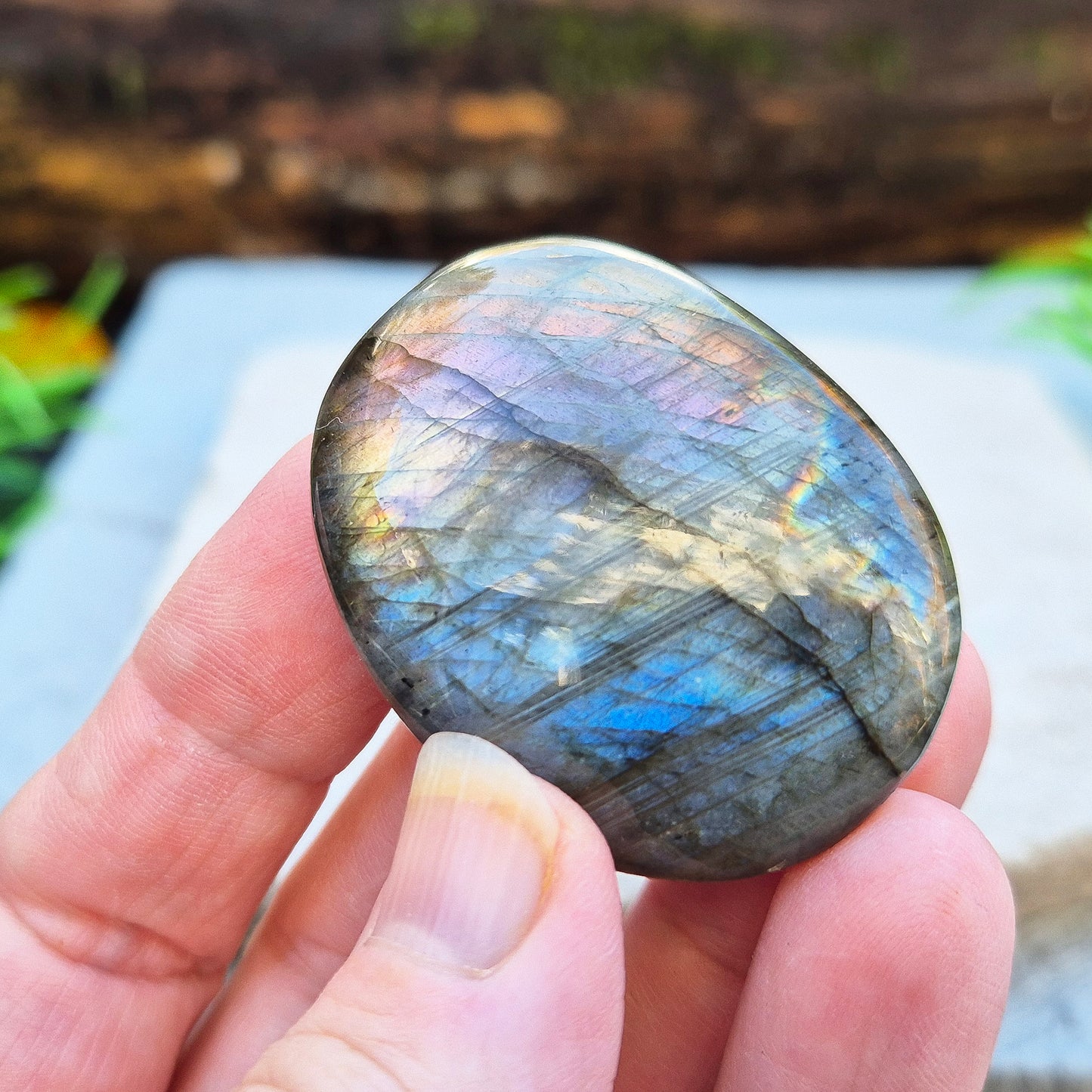 Mystical Labradorite palm stone from Madagascar with vibrant flash. Supports intuition, aura protection & energy clearing. Pocket-sized crystal.