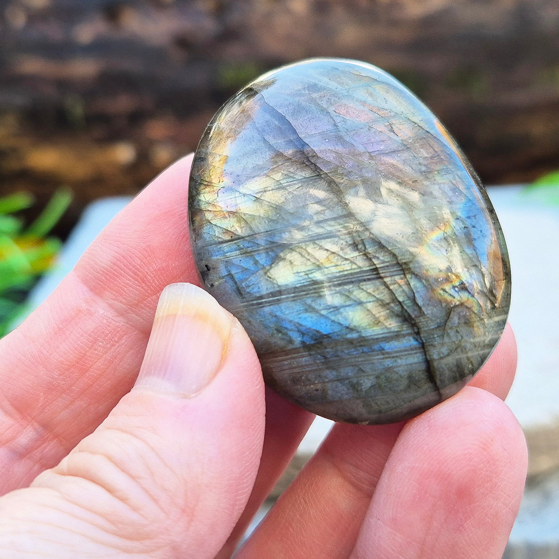 Mystical Labradorite palm stone from Madagascar with vibrant flash. Supports intuition, aura protection & energy clearing. Pocket-sized crystal.