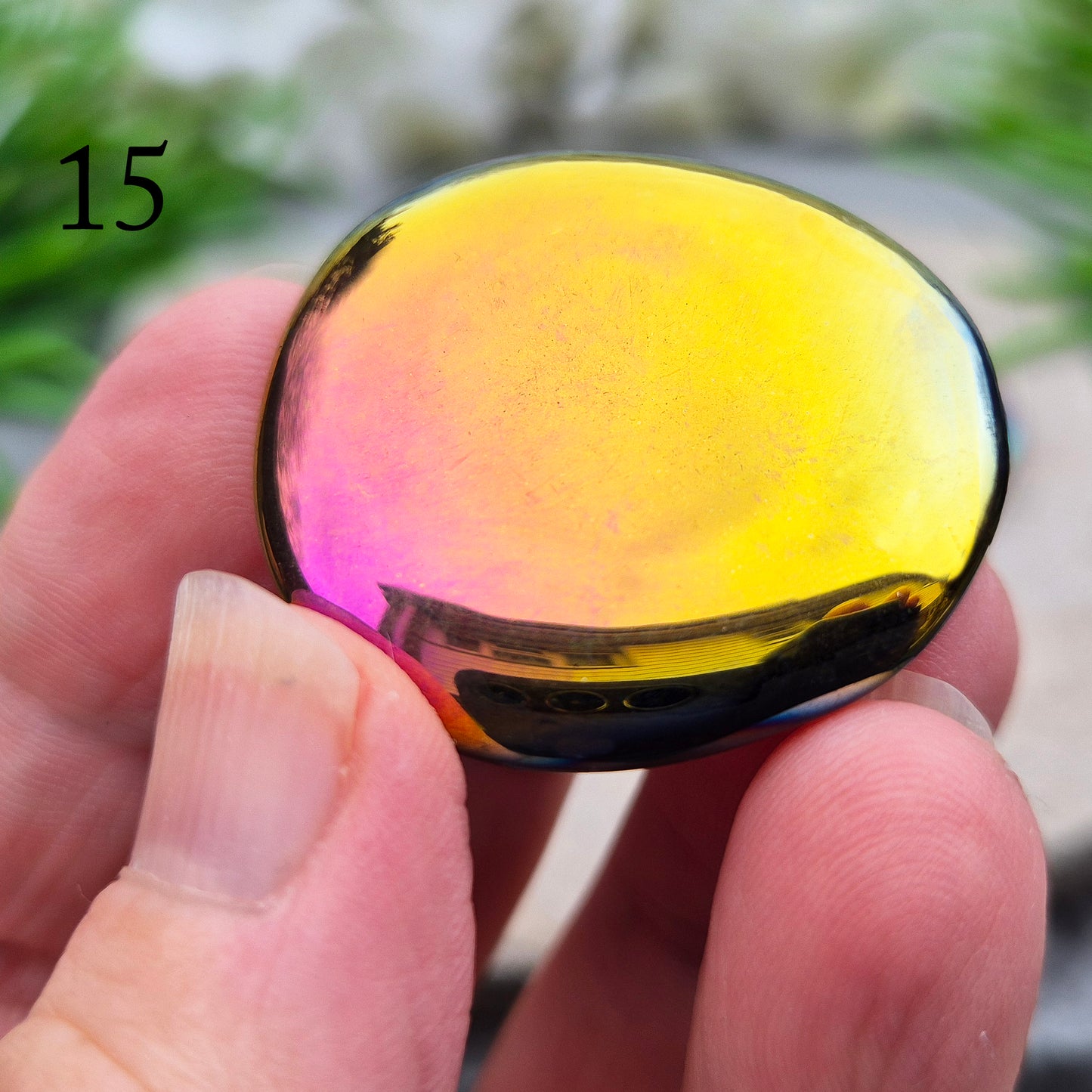 Discover our Titanium Aura Obsidian Palm Stones. This crystal calms anxiety and balances your energy and chakras. It protects against negative energy.