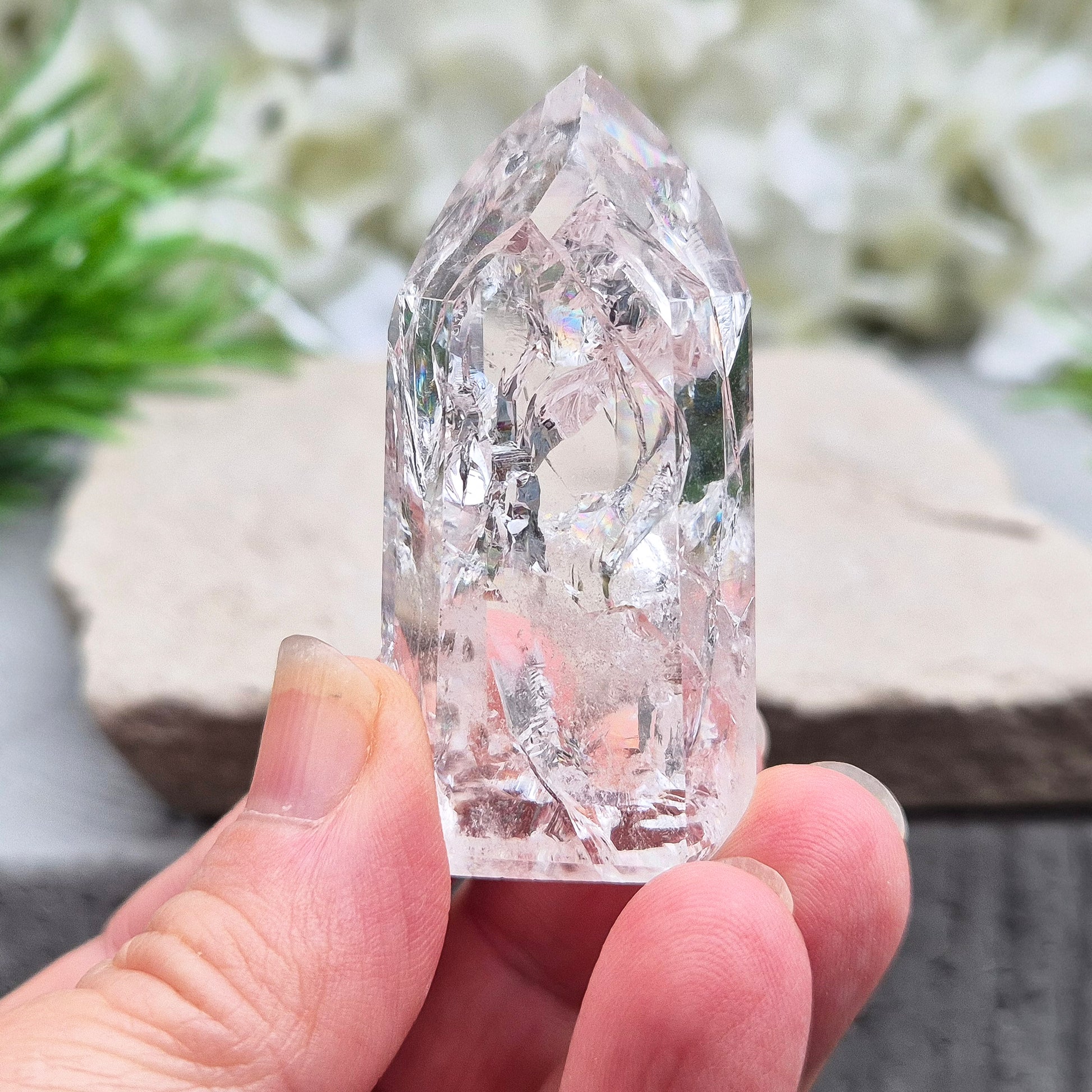 Polished Fire & Ice Quartz point with vibrant internal fractures. Ideal for energy work, meditation and crystal healing. A striking addition to any collection.