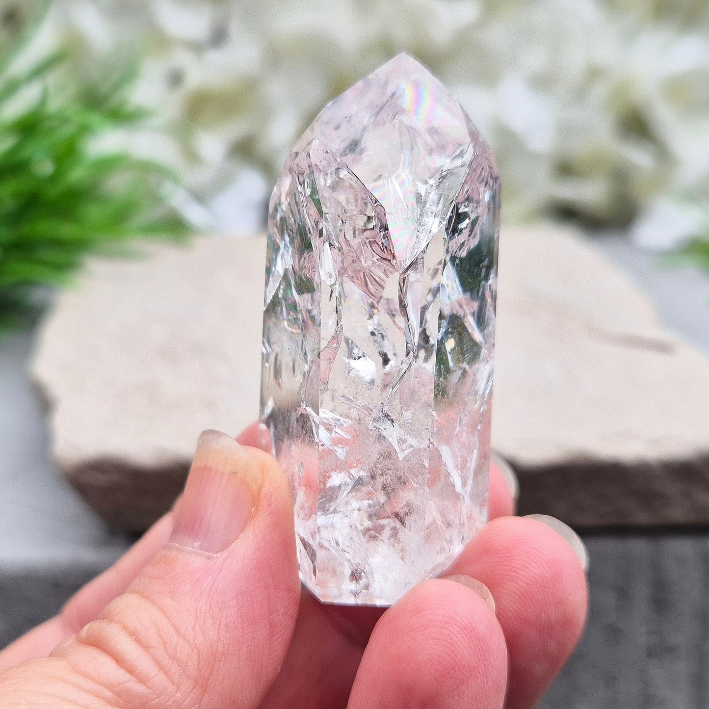 Polished Fire & Ice Quartz point with vibrant internal fractures. Ideal for energy work, meditation and crystal healing. A striking addition to any collection.