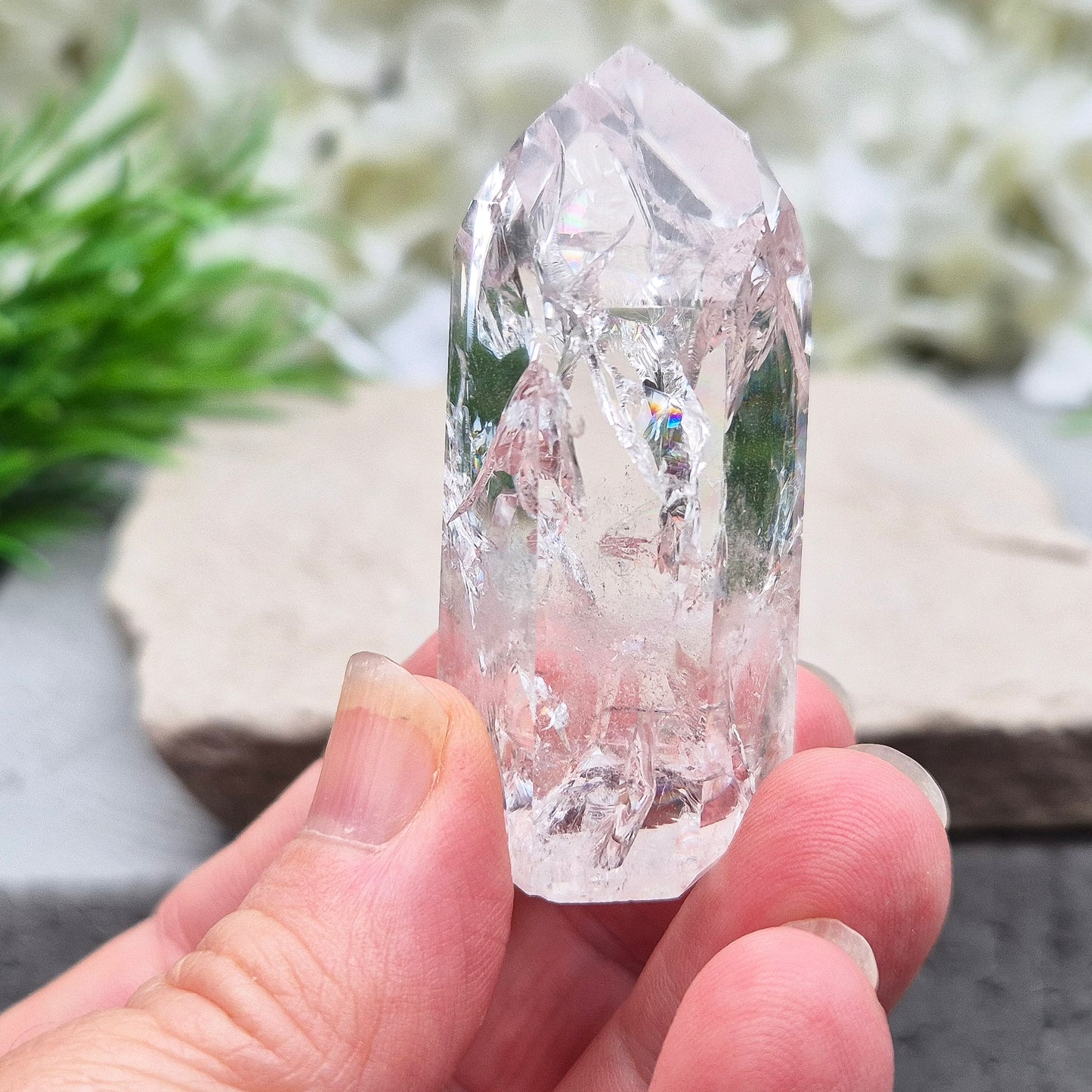 Polished Fire & Ice Quartz point with vibrant internal fractures. Ideal for energy work, meditation and crystal healing. A striking addition to any collection.
