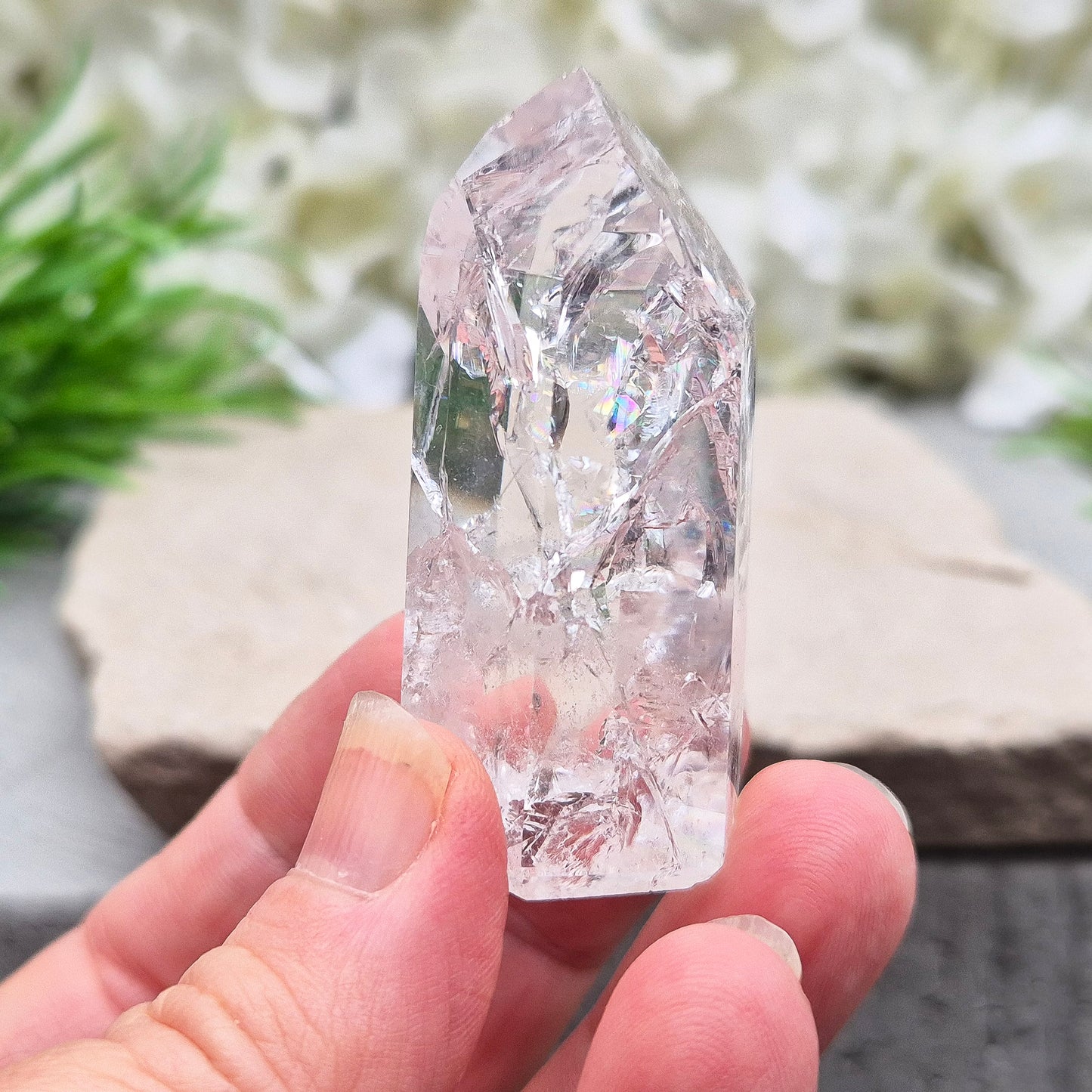 Polished Fire & Ice Quartz point with vibrant internal fractures. Ideal for energy work, meditation and crystal healing. A striking addition to any collection.